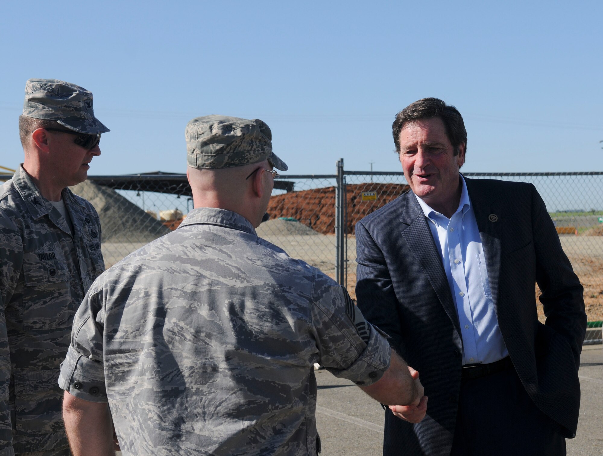 Chief Master Sgt. Edward R. Slacum, 548th Intelligence, Surveillance, and Reconnaissance Group superintendent (center), and Col. Drew Taylor, 548th ISRG deputy commander (left), welcome Congressman John Garamendi to Beale Air Force Base, California, Apr. 06, 2016. Garamendi met with 548th ISRG leadership to discuss the Distributed Ground Station-2 building construction progress. (U.S. Air Force photo by Senior Airman Michael J. Hunsaker)