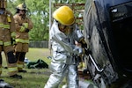 Airman 1st Class Brooke Hunt of the 177th Fighter Wing Fire Department, New Jersey Air National Guard, uses a Halligan tool to break a vehicle window during basic vehicle extrication training exercises at the 165th Airlift Wing's Regional Fire Training Facility in Savannah, Georgia, on April 6th, 2016.  Airmen from the Connecticut, Maine, New Jersey, Rhode Island and Vermont Air National Guard Fire Departments are conducting training exercises together to maintain operational readiness. 