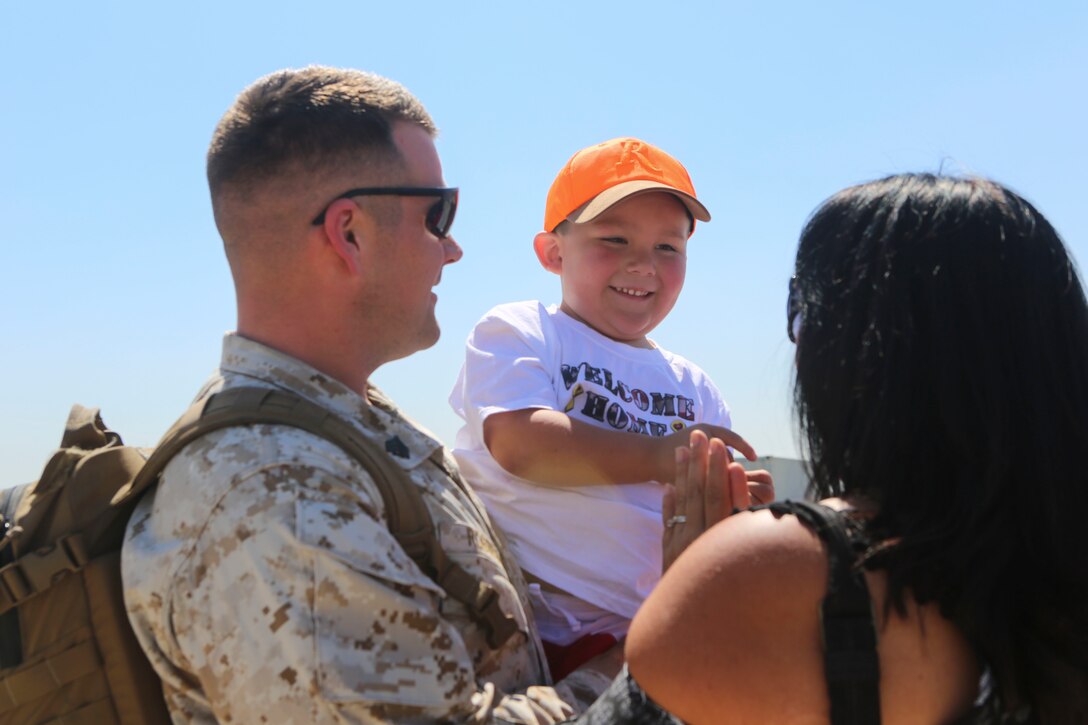 A Marine returning from deployment reunites with his family aboard Marine Corps Air Station Miramar, Calif., April 4. Service members from Marine Wing Support Squadron (MWSS) 372, Marine Medium Tiltrotor Squadron (VMM) 363 and Marine Aviation Logistics Squadron (MALS) 16 returned from a six and a half month deployment with the Special Purpose Marine Air-Ground Task Force – Crisis Response – Central Command in support of Operation Inherent Resolve. (U.S. Marine Corps photo by Lance Cpl. Harley Robinson/Released)