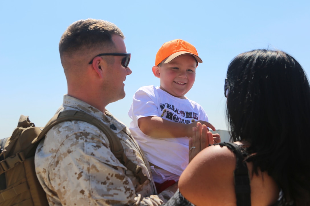 A Marine returning from deployment reunites with his family aboard Marine Corps Air Station Miramar, Calif., April 4. Service members from Marine Wing Support Squadron (MWSS) 372, Marine Medium Tiltrotor Squadron (VMM) 363 and Marine Aviation Logistics Squadron (MALS) 16 returned from a six and a half month deployment with the Special Purpose Marine Air-Ground Task Force – Crisis Response – Central Command in support of Operation Inherent Resolve. (U.S. Marine Corps photo by Lance Cpl. Harley Robinson/Released)