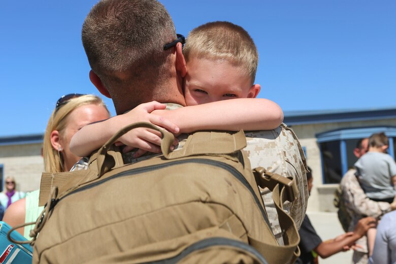 A Marine returning from deployment reunites with his son aboard Marine Corps Air Station Miramar, Calif., April 4. Marines from Marine Wing Support Squadron (MWSS) 372, Marine Medium Tiltrotor Squadron (VMM) 363 and Marine Aviation Logistics Squadron (MALS) 16 returned from a six and a half month deployment with the Special Purpose Marine Air-Ground Task Force – Crisis Response – Central Command in support of Operation Inherent Resolve. (U.S. Marine Corps photo by Lance Cpl. Harley Robinson/Released)