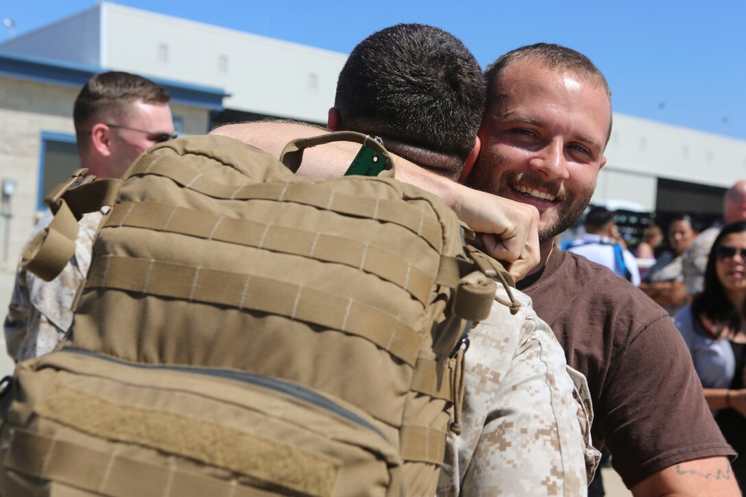 A Marine returning from deployment reunites with his family aboard Marine Corps Air Station Miramar, Calif., April 4. Service members from Marine Wing Support Squadron (MWSS) 372, Marine Medium Tiltrotor Squadron (VMM) 363 and Marine Aviation Logistics Squadron (MALS) 16 returned from a six and a half month deployment with the Special Purpose Marine Air-Ground Task Force – Crisis Response – Central Command in support of Operation Inherent Resolve. (U.S. Marine Corps photo by Lance Cpl. Harley Robinson/Released)