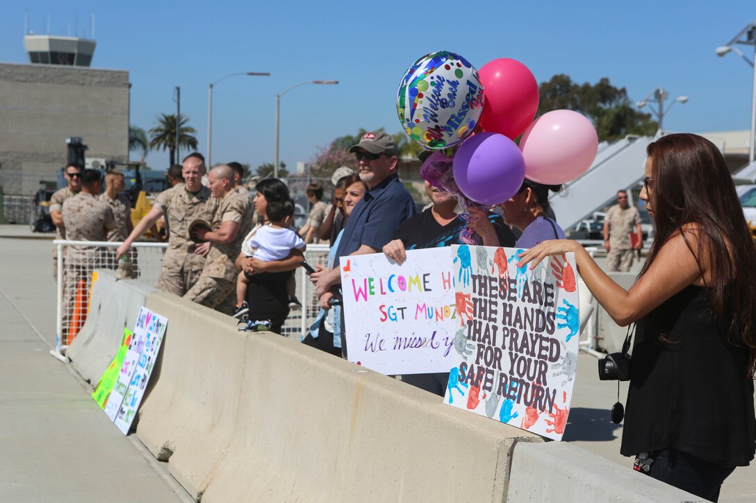 Family and friends gather to reunite with service members from Marine Wing Support Squadron (MWSS) 372, Marine Medium Tiltrotor Squadron (VMM) 363 and Marine Aviation Logistics Squadron (MALS) 16 aboard Marine Corps Air Station Miramar, Calif., April 4. The service members returned from a six and a half month deployment with the Special Purpose Marine Air-Ground Task Force – Crisis Response – Central Command in support of Operation Inherent Resolve. (U.S. Marine Corps photo by Lance Cpl. Harley Robinson/Released)