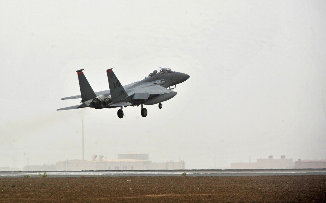 An F-15E Strike Eagle aircraft executes a touch-and-go during Exercise Desert Flag March 30, 2016, at an undisclosed location in Southwest Asia. Desert Flag, also known as Exercise IRON FALCON 16-2, is a three-week long joint and multilateral U.S. Air Forces Central Command-led exercise held semi-annually in Southwest Asia. (U.S. Air Force photo by Staff Sgt. Kentavist P. Brackin/released)