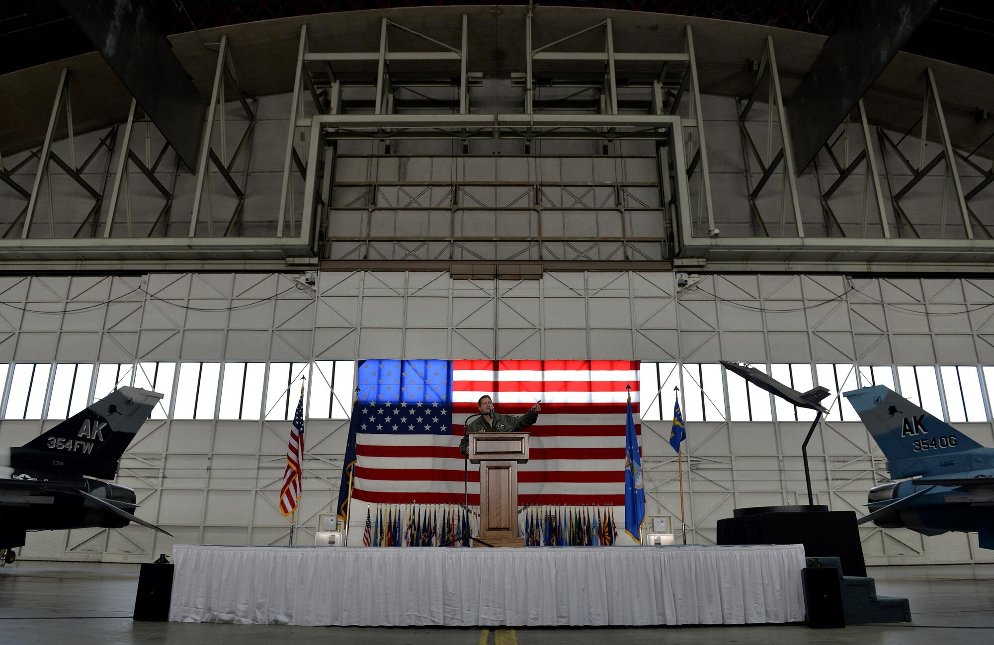Air Force Col. Michael P. Winkler, the 354th Fighter Wing commander, announces the Secretary of the Air Force’s signed decision to select Eielson Air Force Base, Alaska, as the location of the Air Force’s first F-35A operational base in the Pacific Air Forces’ Area of Responsibility during an April 4, 2016, ceremony at Eielson. Basing the F-35s at Eielson will allow the Air Force the capability of using the largest airspace in the Air Force in the Joint Pacific Alaska Range Complex for large-force exercises, ensuring realistic combat training for the Department of Defense. (U.S. Air Force photo by Master Sgt. Karen J. Tomasik/Released)