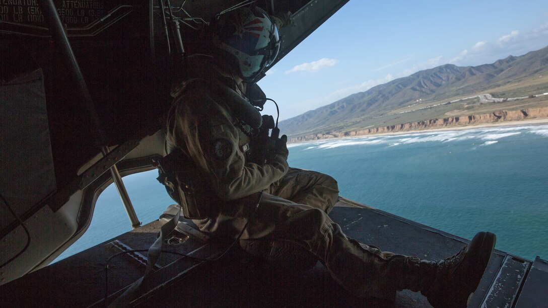 Cpl. Alec Bechtel, a crew chief with Marine Medium Tiltrotor Squadron 161, communicates with pilots during a field carrier landing practice at Marine Corps Base Camp Pendleton, California, March 30, 2016. Marines with VMM-161 conducted field carrier landing practices at Camp Pendleton to maintain their proficiency in landing aboard Navy vessels.