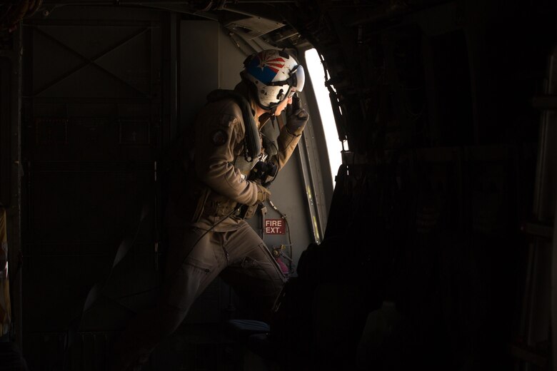 Cpl. Alec Bechtel, a crew chief with Marine Medium Tiltrotor Squadron (VMM) 161 “Greyhawks” and a Mesa, Ariz., native, monitors the distance of nearby aircraft during a confined area landing with Marines from VMM-165 in Southern California, March 30. The training enabled Marines with VMM-161 to build interoperability between squadrons and maintain the proficiency of pilots and aircrew for these maneuvers. (U.S. Marine Corps photo by Sgt. Lillian Stephens/Released)