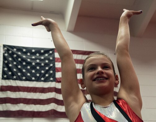 Emma Brittingham, 12, daughter of Lt. Col. Jacob Brittingham, 37th Helicopter Squadron, poses April 2, 2016, after practicing gymnastics in Cheyenne, Wyo. Emma recently won the Wyoming level-8 state gymnastics competition and will be representing Wyoming in a regionals competition on April 15, 2016. (U.S. Air Force photo by Senior Airman Brandon Valle)