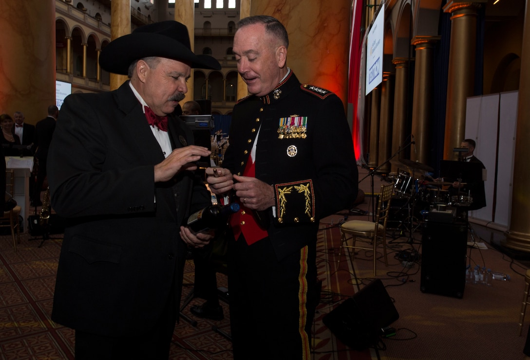 Marine Corps Gen. Joe Dunford, chairman of the Joint Chiefs of Staff, talks with a guest at the Tragedy Assistance Program for Survivors 2016 Honor Guard Gala in Washington, D.C., April 6, 2016. DoD photo by Navy Petty Officer 2nd Class Jesse A. Hyatt
