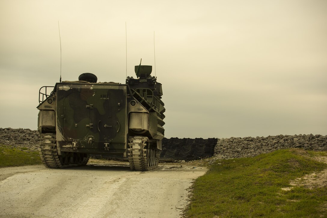 An Amphibious Assault Vehicle with 2nd Assault Amphibian Battalion observes the range before qualifying during Heavy Brigade Combat Team training at Camp Lejeune, N.C., April 5, 2016. The training was designed to reaffirm the vehicle crewmembers ability to employ their expertise in any combat scenario. (U.S. Marine Corps photo by Cpl. Samuel Guerra/Released)