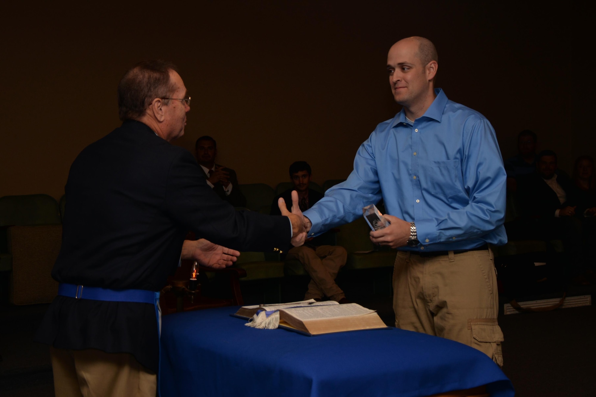 U.S. Air Force Tech. Sgt. James G. Osborn, 315th Training Squadron instructor, receives the Community Builder Award at the Concho Lodge #1260 in San Angelo, Texas, April 2, 2016. The Grand Lodge Texas designed the award to recognize outstanding non-Masons who have distinguished themselves through their service to the community, to the local state or national government, to their house of worship, or to humanity. Osborn and his team built 12 ramps for people that are homebound and cannot afford to purchase their own wheelchair ramp. (U.S. Air Force photo by Airman 1st Class Randall A.S. Moose/Released)