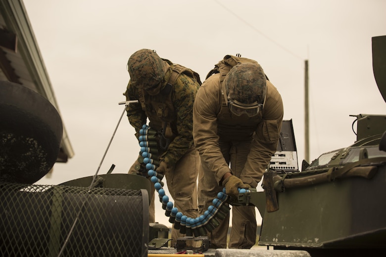 Marines with 2nd Assault Amphibian Battalion load 40 mm practice rounds onto their Amphibious Assault Vehicle during Heavy Brigade Combat Team training at Camp Lejeune, N.C., April 5, 2016. The AAV also provides accurate .50 caliber suppression to effectively incapacitate enemy combatants. (U.S. Marine Corps photo by Cpl. Samuel Guerra/Released)