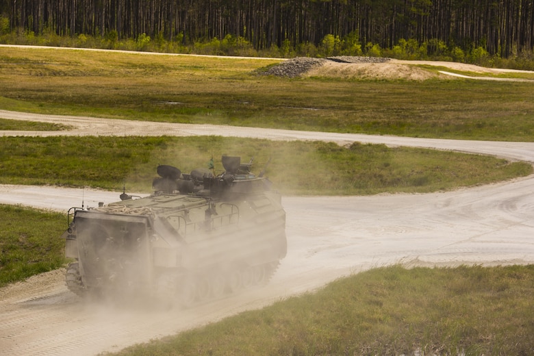 An Amphibious Assault Vehicle with 2nd Assault Amphibian Battalion travels to the starting point for a qualification course during Heavy Brigade Combat Team training at Camp Lejeune, N.C., April 5, 2016. The training gave leaders the opportunity to observe how effectively their Marines operate the vehicles and detect any vehicle deficiencies in preparation for upcoming deployments. (U.S. Marine Corps photo by Cpl. Samuel Guerra/Released)  