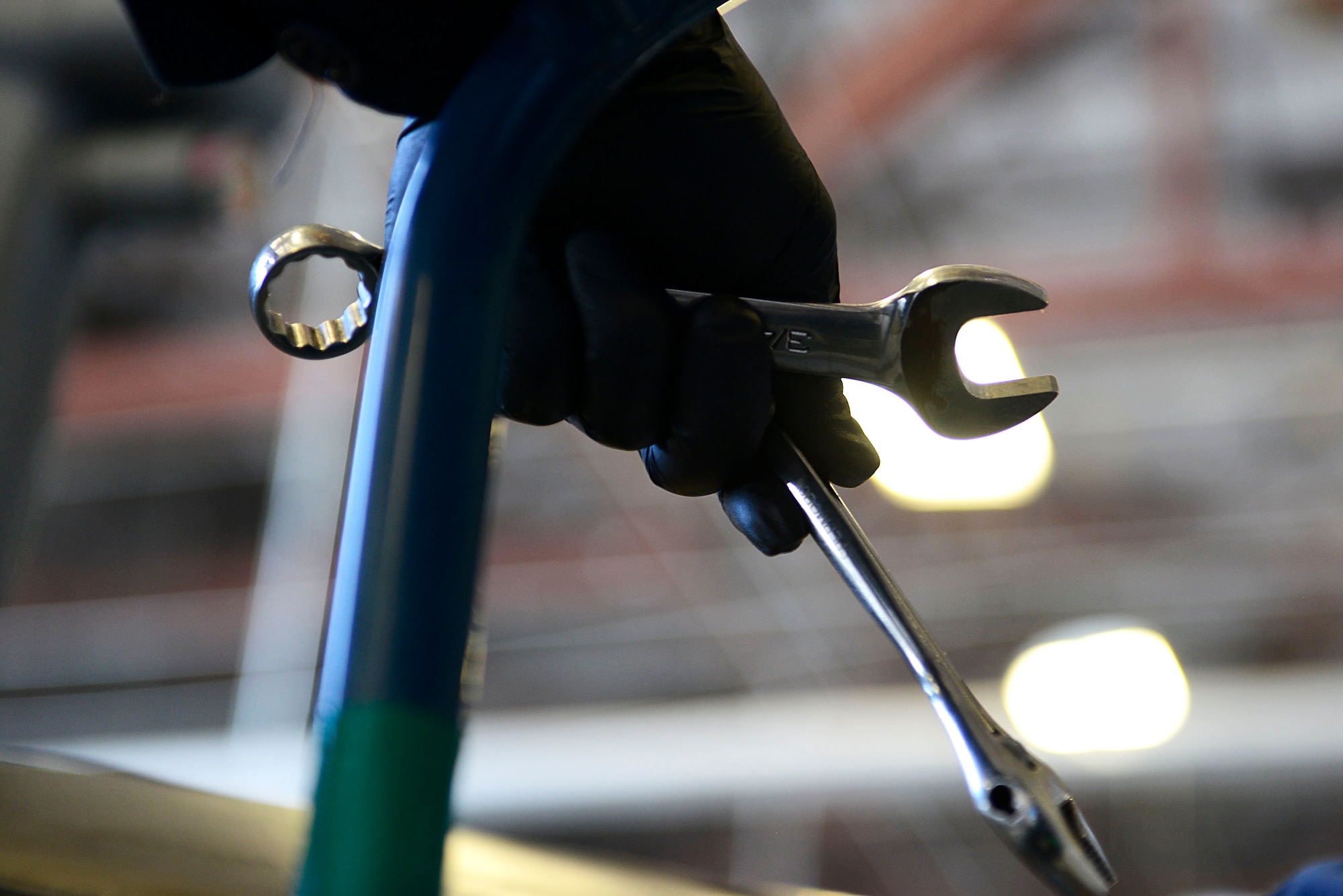 U.S. Air Force Senior Airman Matthew Whitehurst, 20th Component Maintenance Squadron aerospace propulsion journeyman, holds tools while conducting technical orders at Shaw Air Force Base, S.C., March 28, 2016. TOs are procedures that help Airmen in many career fields identify and repair any areas in need of technical attention. (U.S. Air Force photo by Airman 1st Class Christopher Maldonado) 
