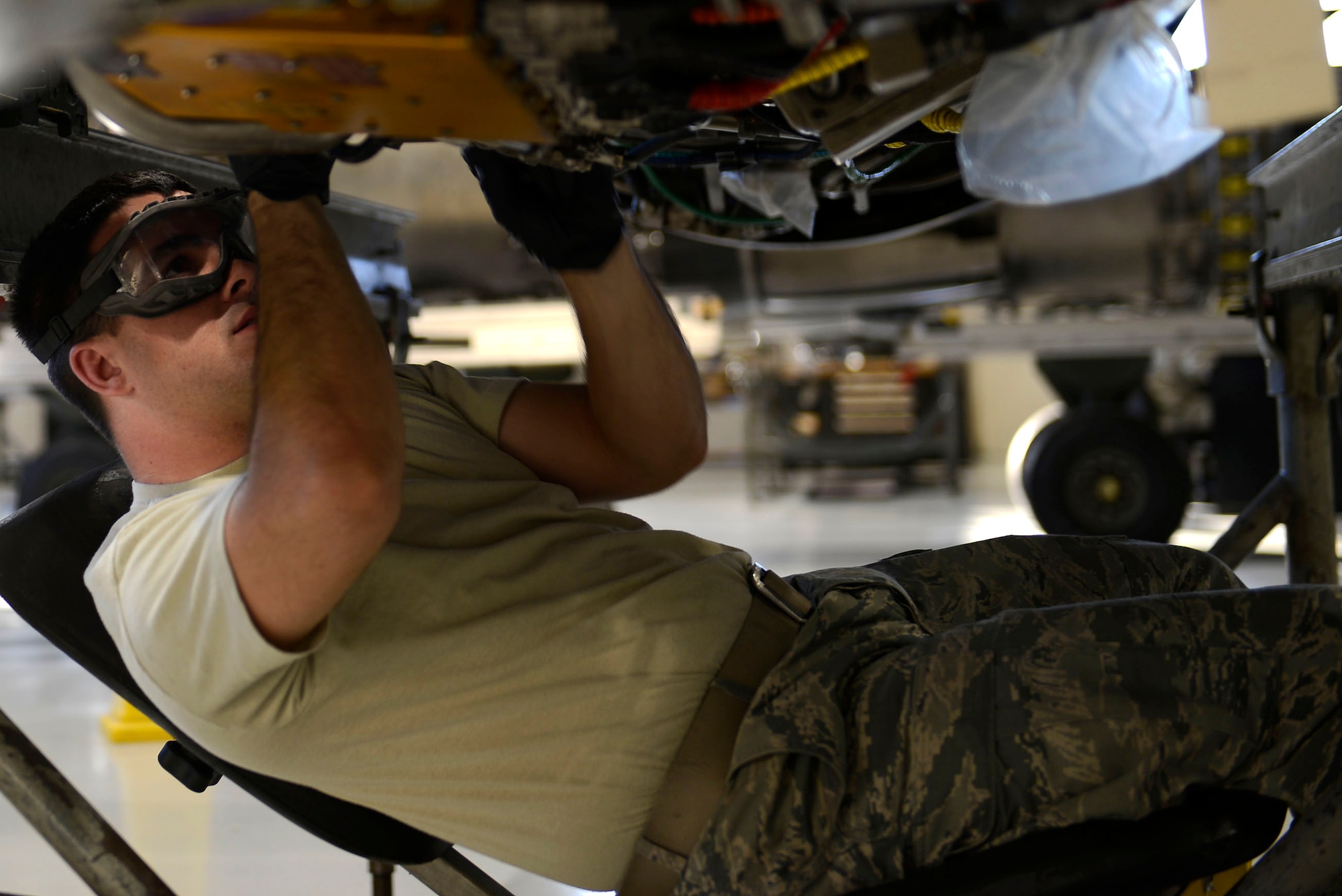 U.S. Air Force Senior Airman Mathew Vance, 20th Component Maintenance Squadron aerospace propulsion journeyman, installs a fuel tube onto an F-16CM Fighting Falcon engine at Shaw Air Force Base, S.C., March 29, 2016. The tube is installed to ensure that the F-16 has the fuel needed to power the afterburner and deliver over 29,000 pounds of thrust. (U.S. Air Force photo by Airman 1st Class Christopher Maldonado)