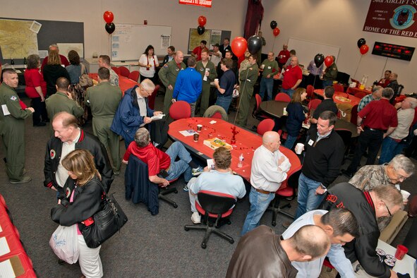 Attendees at the “Red Devil Reunion” for the 50th Airlift Squadron, reconnect before the opening ceremony at Little Rock Air Force Base, Ark., Apr. 1, 2016. Until recently, the 50 AS maintained an active association with the 913th Airlift Group, where their Airmen worked side by side with Reserve Airmen on Reserve aircraft. (U.S. Air Force photo by Master Sgt. Jeff Walston/Released) 