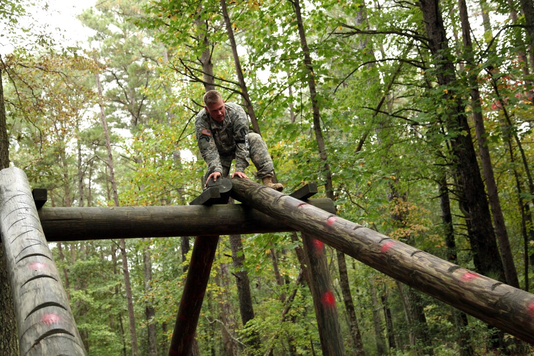 U.S. Army Staff Sgt. Andrew Fink, assigned to 409th Area Support Medical Company, U.S. Army Reserve Command, maneuvers through an obstacle during the U.S. Army’s Best Warrior Competition at Fort A.P. Hill, Va., Oct. 5, 2015. The competition is a grueling, weeklong event that tests the skills, knowledge and professionalism of 26 warriors representing 13 commands. (U.S. Army photo by Pfc. Christopher Brecht/Released) #BestWarrior