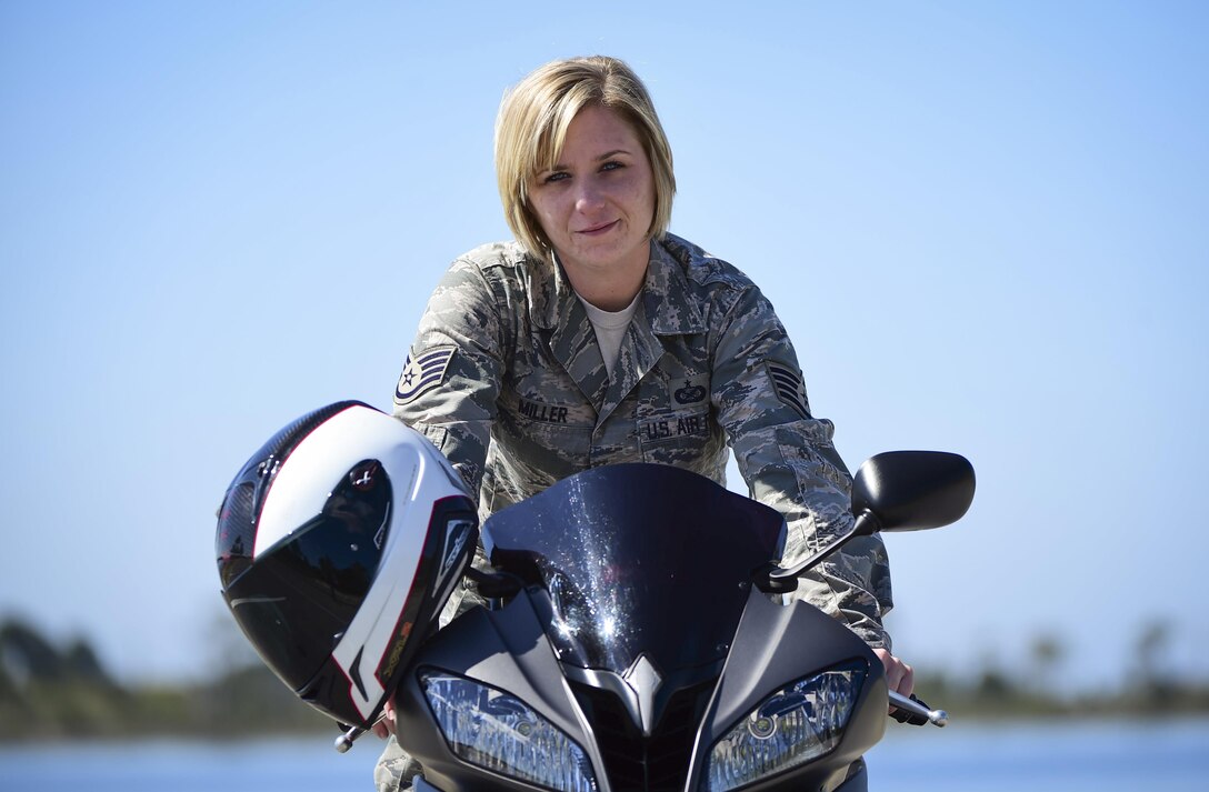 Staff Sgt. Marleah Miller, a photojournalist with the 1st Special Operations Wing Public Affairs, poses for a photo on her 2013 Yamah R6 motorcycle at Hurlburt Field, Fla., April 7, 2016. (U.S. Air Force photo by Staff Sgt. Christopher Callaway)