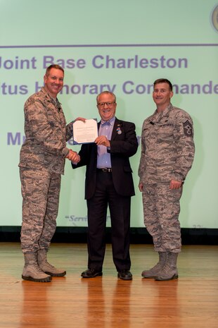 Air Force Col. Robert Lyman, Joint Base Charleston commander, left, and Command Chief Master Sgt. Mark Bronson, 628th Air Base Wing command chief, present the Commander's Public Service Award to Peter Wertimer, Founder and Chairman of the Palmetto Military Support Group and JB Charleston Emeritus Honorary Commander, during a commander's call at JB Charleston Mar. 30, 2016. Wertimer received the award for his outstanding public service and commitment to military families at JB Charleston from January 2001 to March 2016, including the Palmetto Military Support Group's efforts to support all Soldiers, Sailors, Airmen, Marines and Coast Guardsmen of the Lowcountry region. He supported the military by initiating and leading efforts to raise money to defray costs of special activities, permitting more enlisted personnel to attend special local events and improving military life.

Additionally, Wertimer was a key board member for the Charleston Research Institute advancing research at the Ralph H. Johnson Veterans Affairs Medical Center improving the lifestyle and supporting our veteran community. The Commander's Public Service Award is presented to recognize service or achievements which contribute significantly to the accomplishment of the mission of an Air Force activity, command or staff agency. (U.S. Air Force photo/Tech. Sgt. Christopher Cross)
