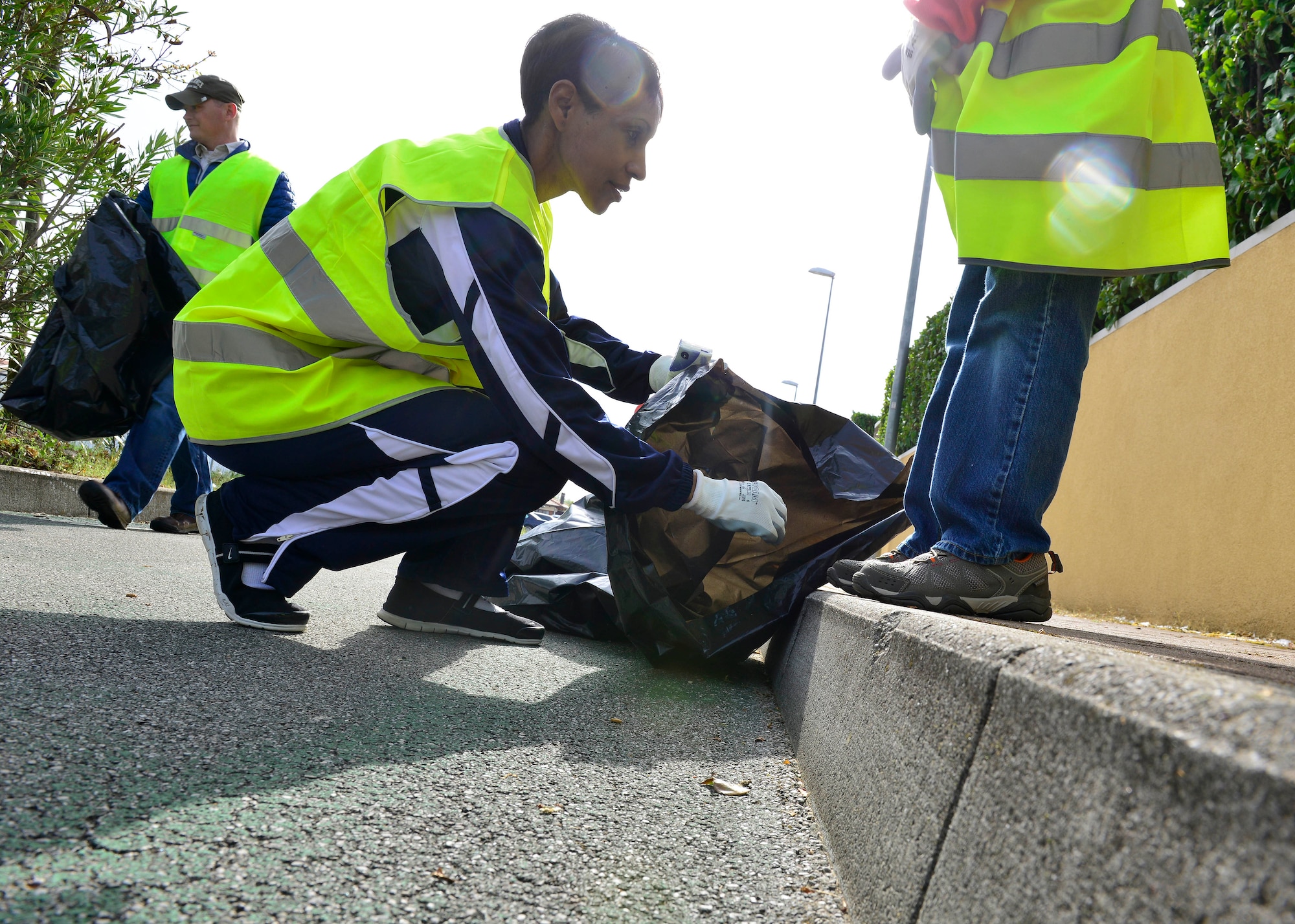Col. Jenise Carroll, 31st Mission Support Group commander, picks up trash during the Roveredo in Piano, Italy, Ecological Day, April 3, 2016. Team Aviano members teamed up with local Italians to strengthen relationships with our Italian hosts. (U.S. Air Force photo by Airman 1st Class Cary Smith/Released)