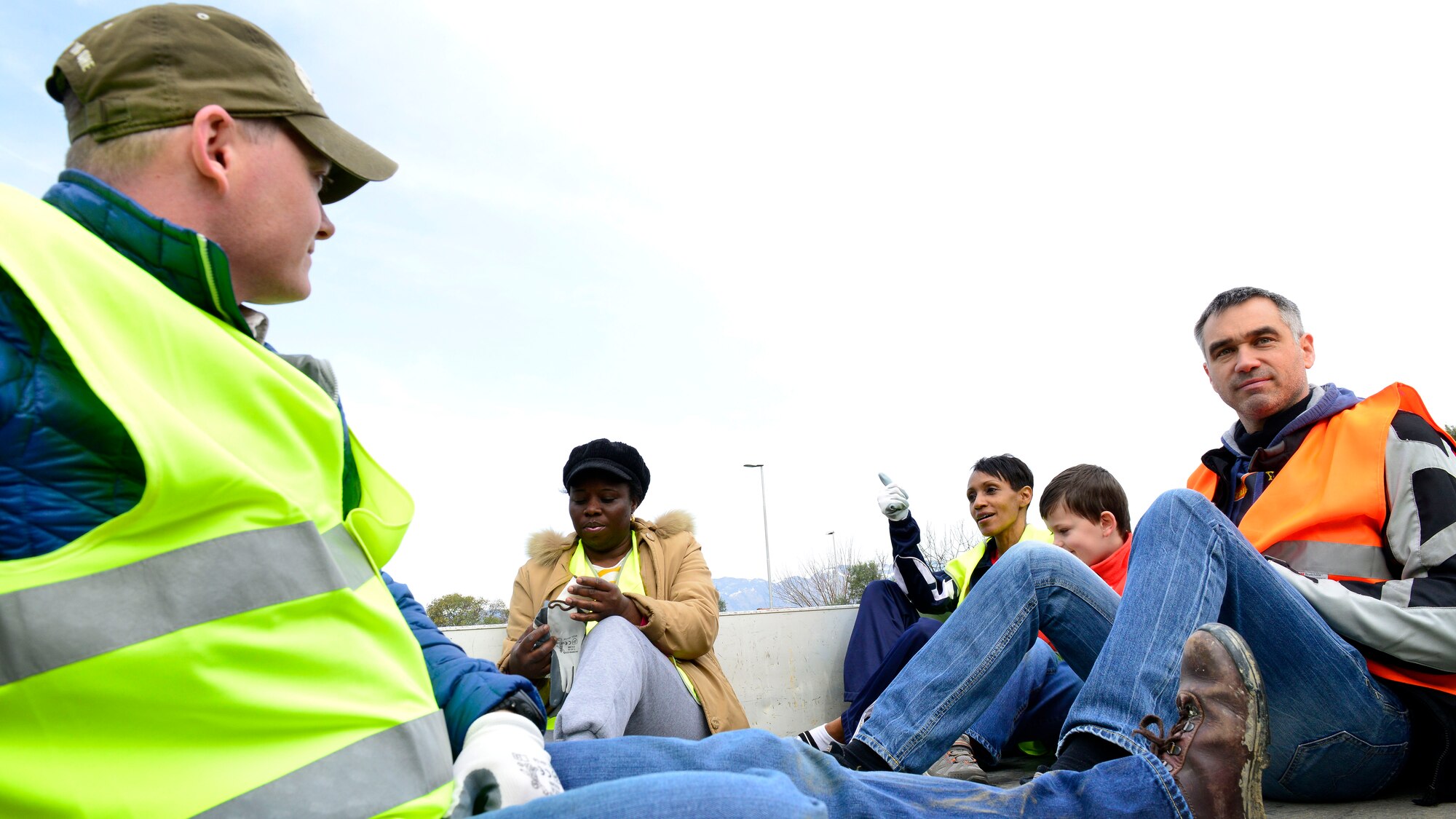 Col. Stefano Cianfrocca, Aviano Airport Commander, and volunteers ride to designated areas to pick up trash during the Roveredo in Piano, Italy, Ecological Day, April 3, 2016. Team Aviano members teamed up with local Italians to strengthen relationships with our Italian hosts. (U.S. Air Force photo by Airman 1st Class Cary Smith/Released) 