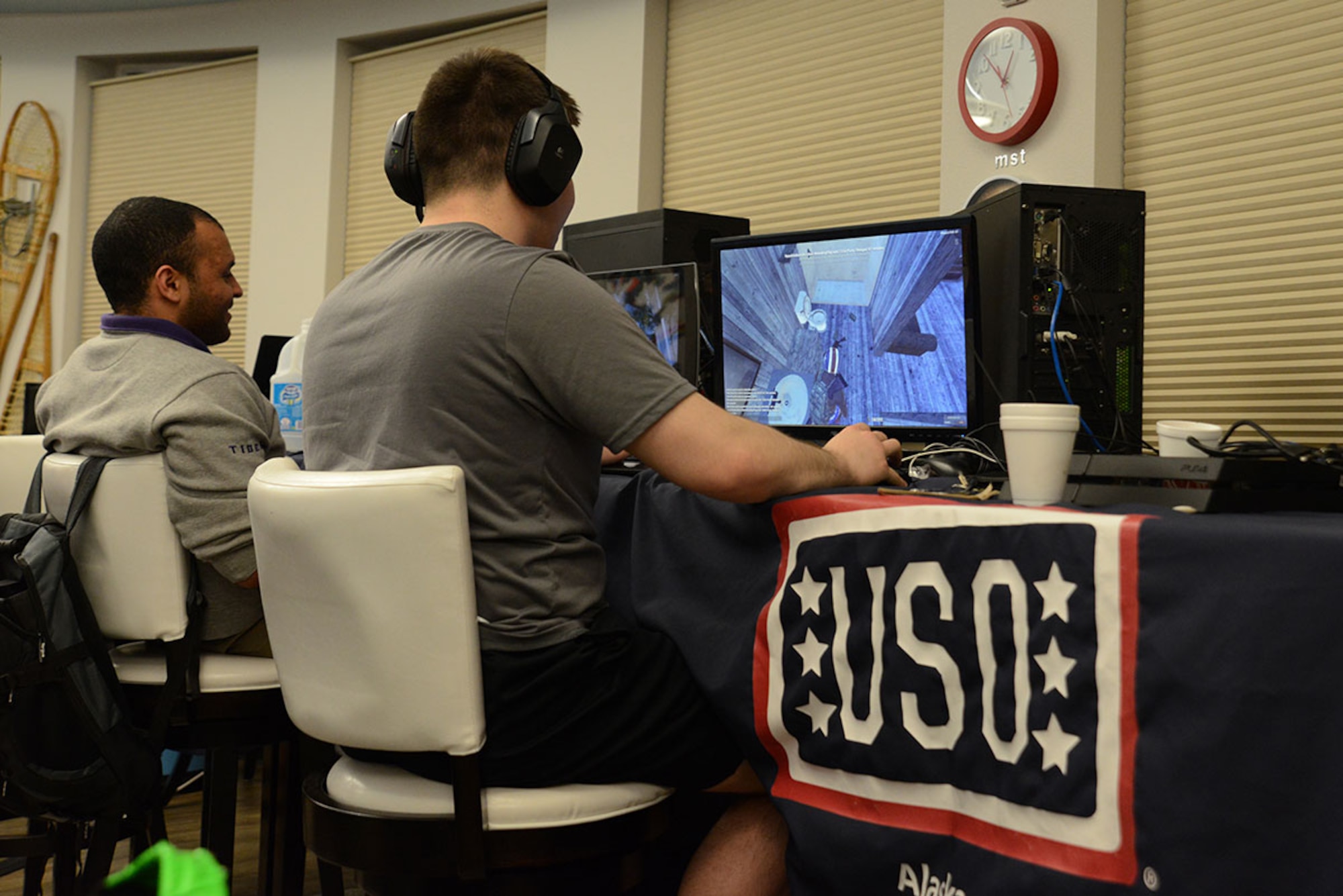 A couple of gamers play on their personal computers during the first LAN party at the USO at Joint Base Elmendorf-Richardson, Alaska, April 2, 2016. Local area network parties bring console or personal computer gamers together for planned group play such as multi-player or one-on-one games. The LAN party was set up by JBER gamers and hosted by the USO for anyone with base access. (U.S. Air Force photo by Airman 1st Class Christopher R. Morales)