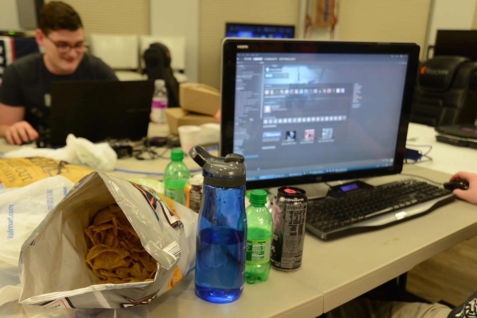 Gamers fuel on snack and drink during the first LAN party at the USO at Joint Base Elmendorf-Richardson, Alaska, April 2, 2016. The local area network party was scheduled from noon to midnight, and snacks and beverages were also provided by the USO throughout the event. (U.S. Air Force photo by Airman 1st Class Christopher R. Morales)