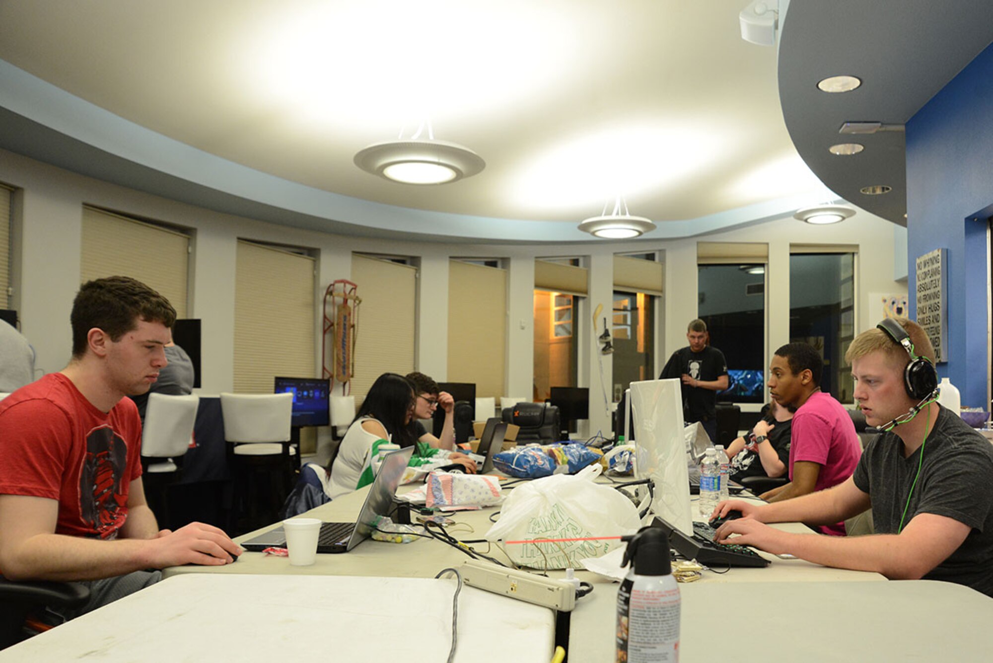 Gamers unite for the first LAN party at the USO at Joint Base Elmendorf-Richardson, Alaska, April 2, 2016. Local area network parties bring console or personal computer gamers together for planned group play such as multi-player or one-on-one games. The LAN party was set up by JBER gamers and hosted by the USO for anyone with base access. (U.S. Air Force photo by Airman 1st Class Christopher R. Morales)