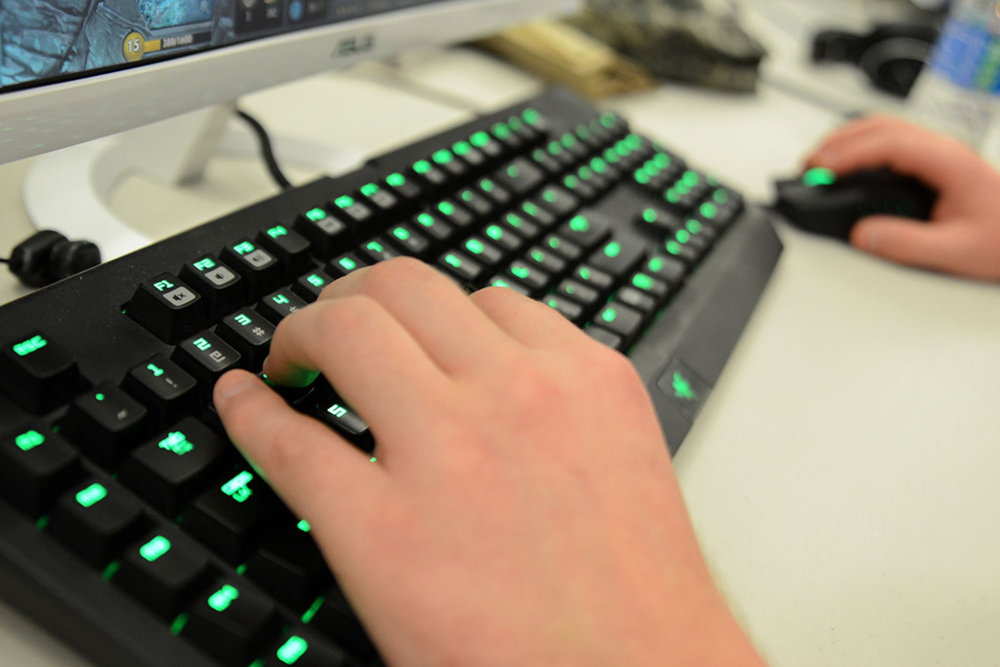A gamer plays on his personal computer during the first LAN party at the USO at Joint Base Elmendorf-Richardson, Alaska, April 2, 2016. Gamers may bring a console, laptop or PC setup to network, and play multi-player or one-on-one games together in one room. The LAN party was set up by JBER gamers and hosted by the USO for anyone with base access. (U.S. Air Force photo by Airman 1st Class Christopher R. Morales)