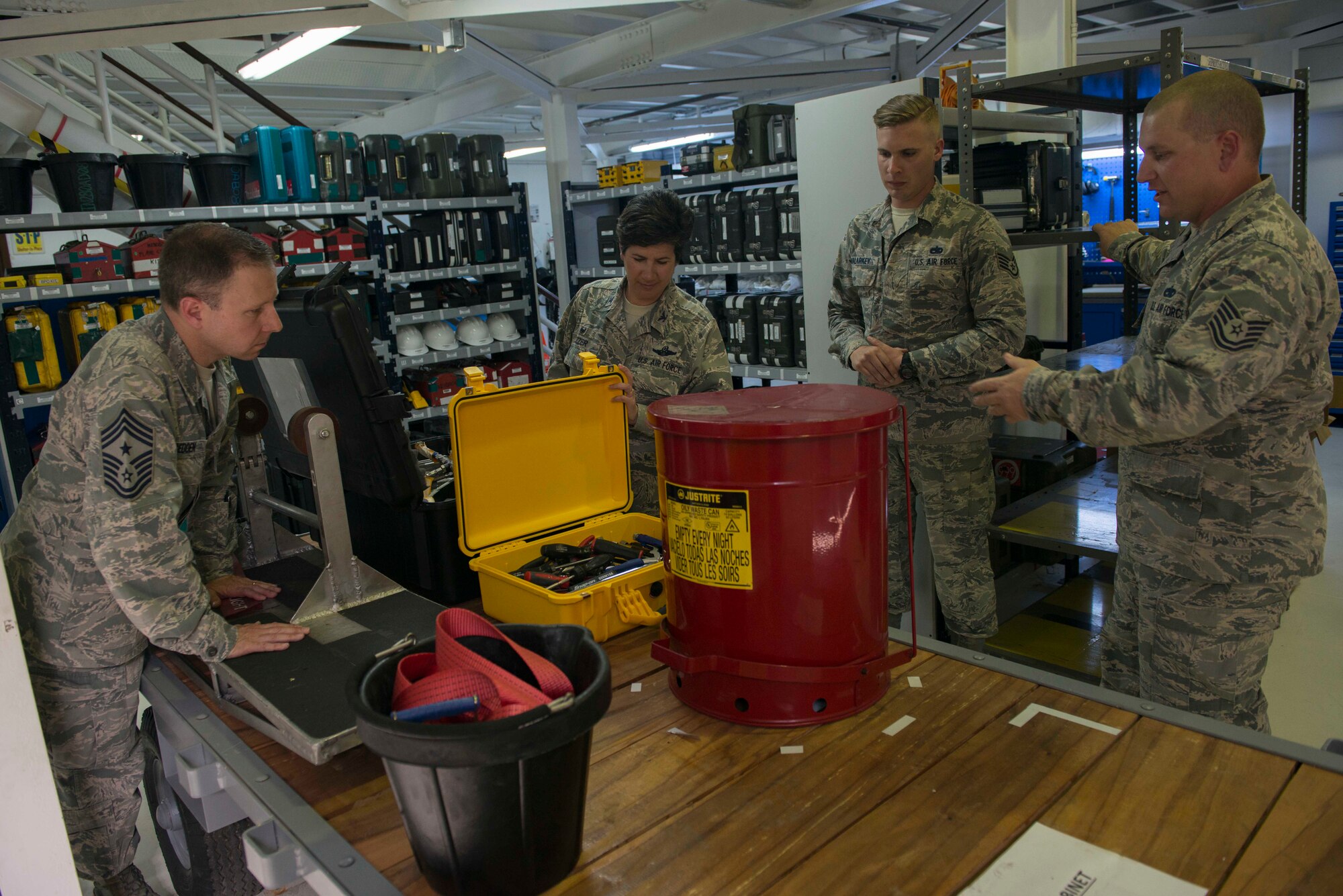 U.S. Air Force Tech. Sgt. Corey Borque, 728th Aircraft Mobility Squadron aircraft maintenance assistant flight chief, and U.S. Air Force Staff Sgt. Devon Malarkey, 728th AMS consolidated tool kit program manager, showcase a tool trailer to U.S. Air Force Col. Nancy Bozzer, 521st Air Mobility Operations Wing commander, and U.S. Air Force Chief Master Sgt. Mark Redden, 521st AMOW command chief, April 5, 2016, at Incirlik Air Base, Turkey. Borque and Malarkey explained the improvements that have been implemented in the work center. (U.S. Air Force photo by Senior Airman John Nieves Camacho/Released)