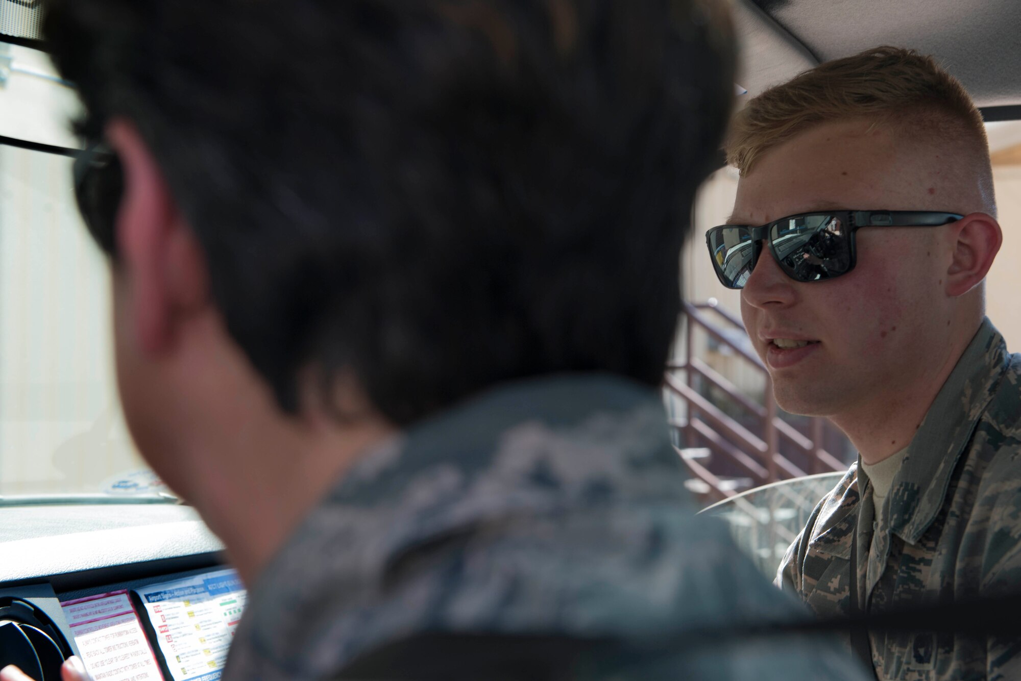 U.S. Air Force Airman Evan Fisher, 728th Air Mobility Squadron passenger service agent, monitors U.S. Air Force Col. Nancy Bozzer, 521st Air Mobility Operations Wing commander, as she operates a staircase truck, April 4, 2016, at Incirlik Air Base, Turkey. The 728th AMS is a tenant unit at Incirlik AB and falls under the 521st AMOW command, based at Ramstein AB. (U.S. Air Force photo by Senior Airman John Nieves Camacho/Released)