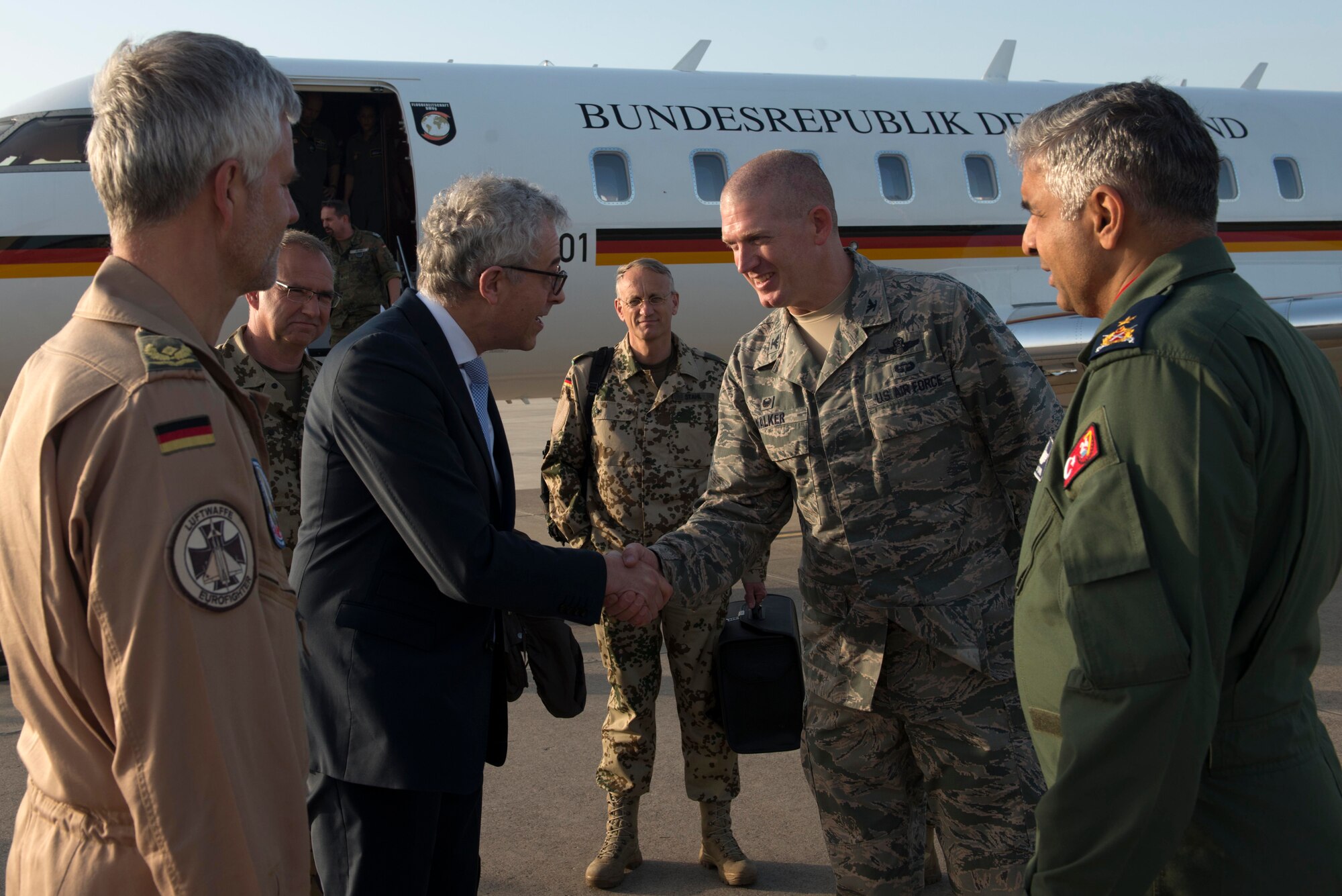 Gerd Hoofe, German State Secretary at the Federal Ministry of Defense, is greeted by Col. John Walker, 39th Air Base Wing commander, April 6, 2016, at Incirlik Air Base, Turkey. Hoofe came to Incirlik AB to observe German operations first-hand. (U.S. Air Force photo by Senior Airman John Nieves Camacho/Released)