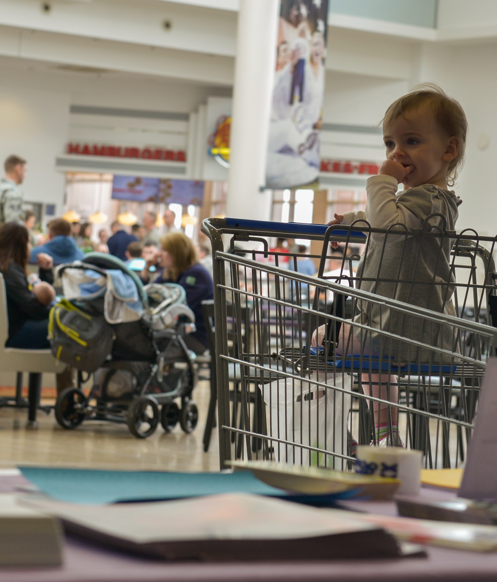 A baby observes the kiosk for the Purple Crying: Understanding Your Crying Baby display April 6, 2016, at Ramstein Air Base, Germany. The display provided parents helpful information on how to read their infants’ body language better so they can help resolve their children’s issues. (U.S. Air force photo/Airman 1st Class Lane T. Plummer)