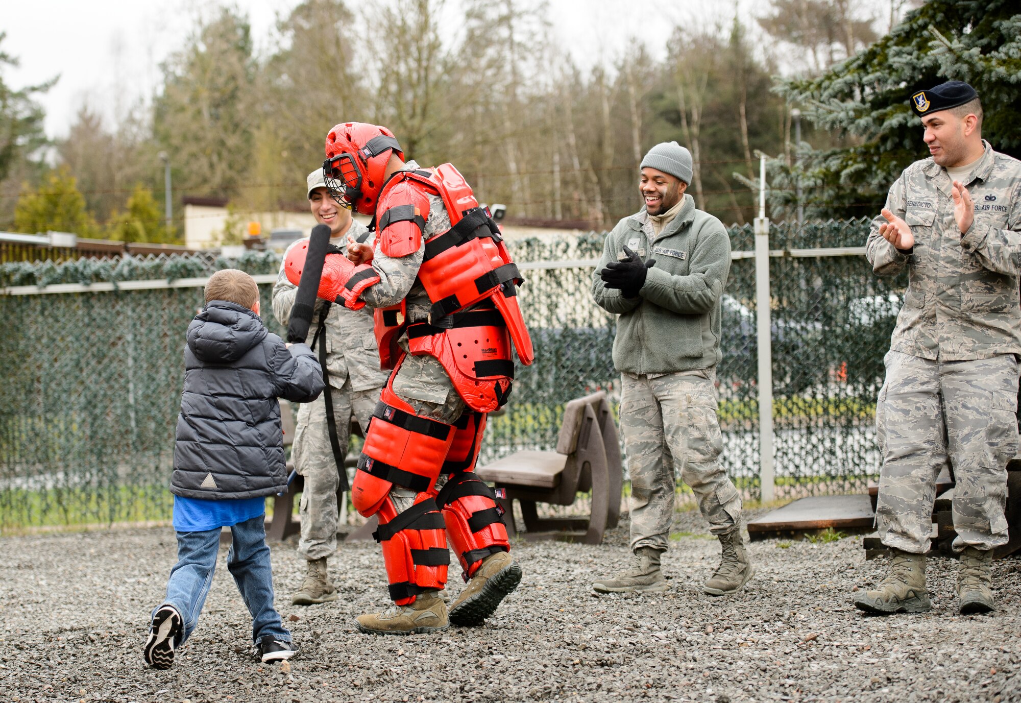 Airmen from the 86th Security Forces Squadron watch a training drill between a Ramstein Intermediate School student and a security forces member at Ramstein Air Base, Germany, April 1, 2016. Children followed in the footsteps of their parents during a mock deployment hosted by one of the 435th Air Ground Operations Wing’s squadrons. (U.S. Air Force photo/Senior Airman Jonathan Stefanko)