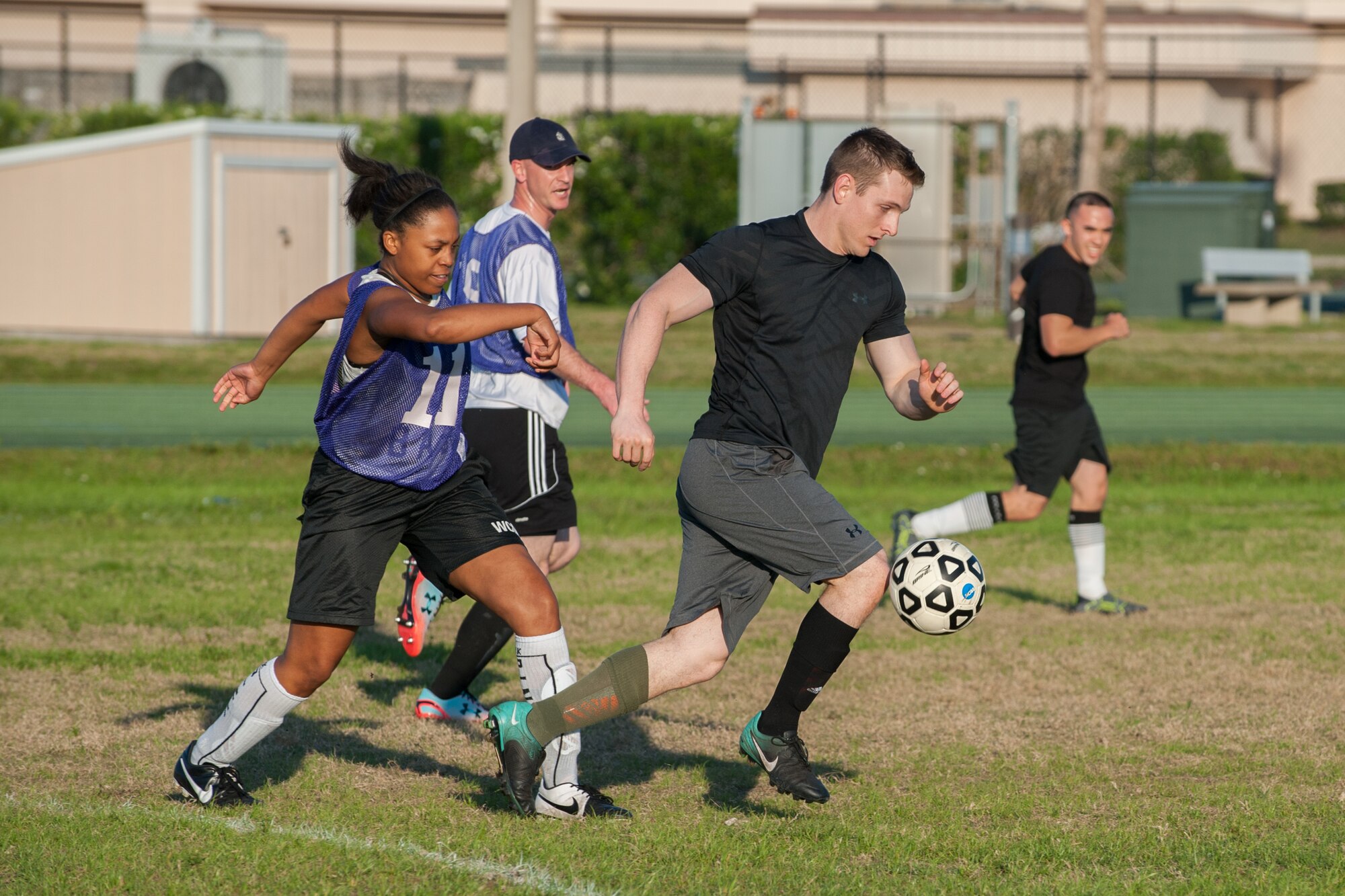 Staff Sgt. Zachery Dunphy, 45th Medical Group, kicks the ball away from the opposing team, 45th Operation Support Squadron, during Patrick Air Force Base’s intramural soccer double elimination tournament April 5.  Although, the MDG won the semifinal game of the season scoring a victory over the 45th OSS, the 45th OSS ultimately won the base championship title.  Eight base teams were vying for the win during the tournament. (U.S. Air Force photo by Benjamin Thacker/Released)