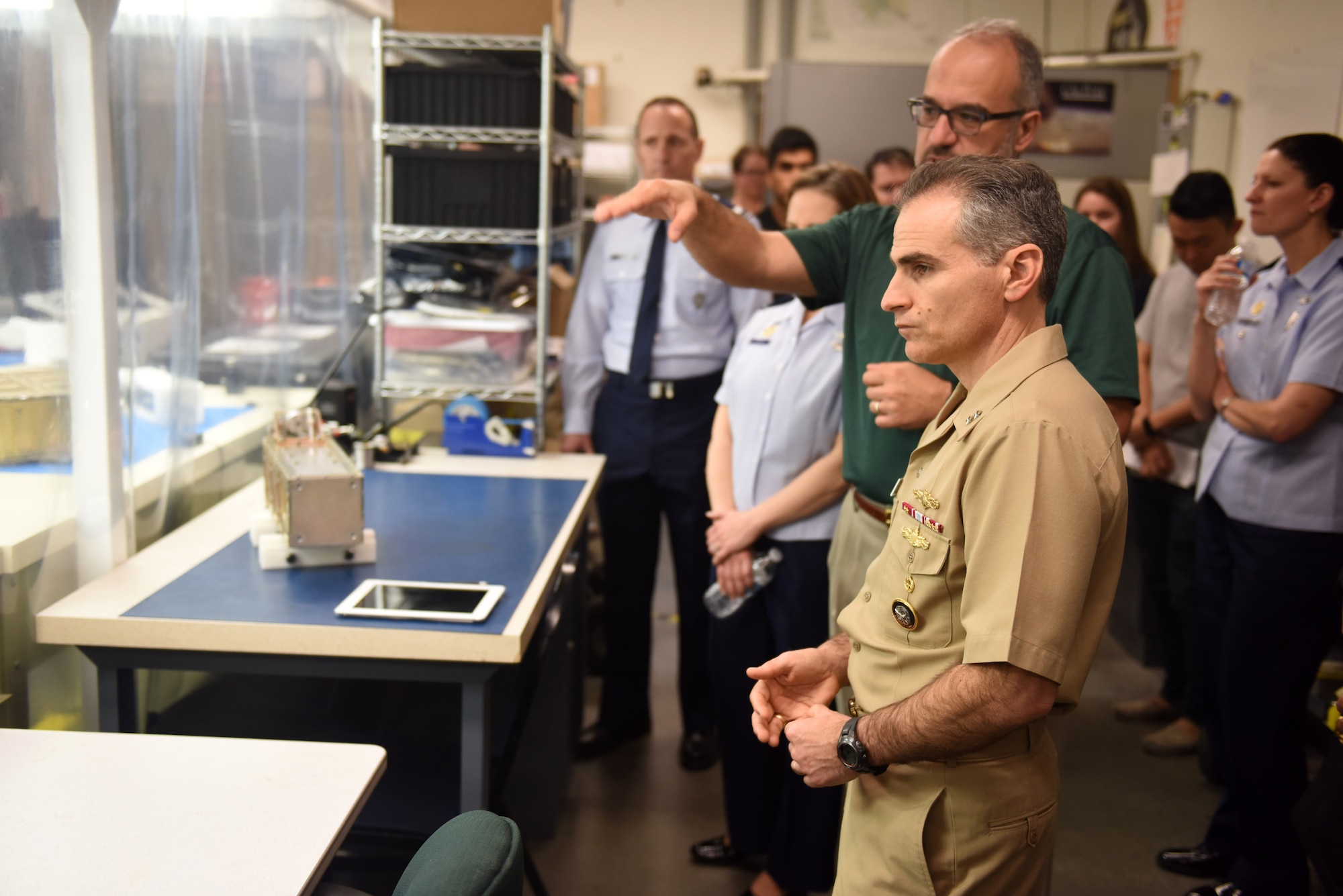 U.S. Navy Rear Adm. Brian Brown, deputy commander, Joint Functional Component Command for Space, listens to a presentation of the CubeSat program during a recent visit to California Polytechnic State University, April 1, San Luis Obispo, Calif. During his visit, Brown spoke with members of Cal Poly’s CubeSat program on various topics such as CubeSats, which are satellites made up of mutiples of 10-centimeter cube units, their thoughts on the industry and where it’s headed, and the ongoing partnership between Cal Poly and Vandenberg. (U.S. Air Force photo by Airman 1st Class Robert J. Volio/Released)
