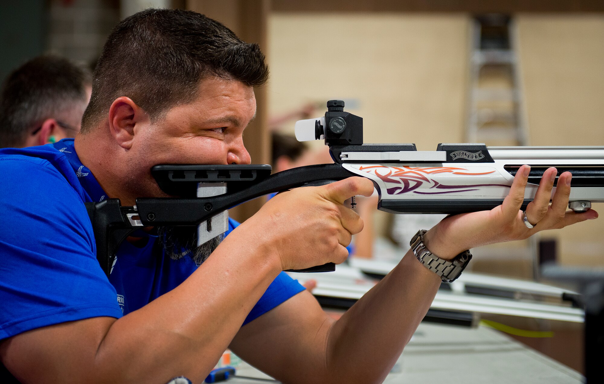 Courtney Hinson, a Warrior Care attendee, aims his rifle downrange during a target-shooting session at the adaptive sports camp at Eglin Air Force Base, Fla., April 6. The base hosts the week-long Wound Warrior Care event that helps recovering wounded, ill and injured military members through specific hand-on rehabilitative training. (U.S. Air Force photo/Samuel King Jr.)