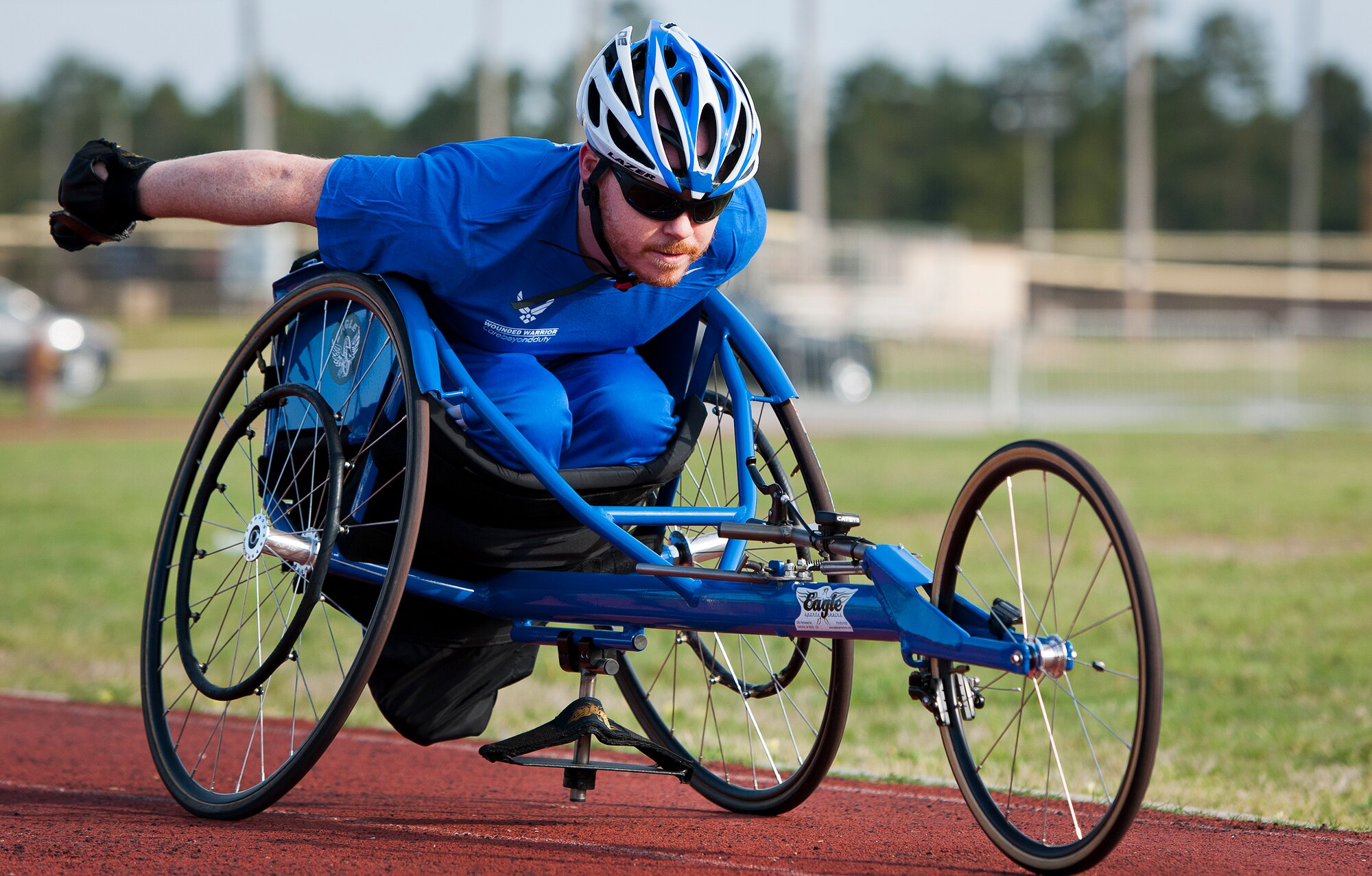 Cory Sandoval, a Warrior Games athlete, coasts around the track using a sports chair during a morning track and field session at the Air Force team’s training camp at Eglin Air Force Base, Fla., April 6.  The base-hosted, week-long Warrior Games training camp is the last team practice session before the yearly competition in June.  (U.S. Air Force photo/Samuel King Jr.)