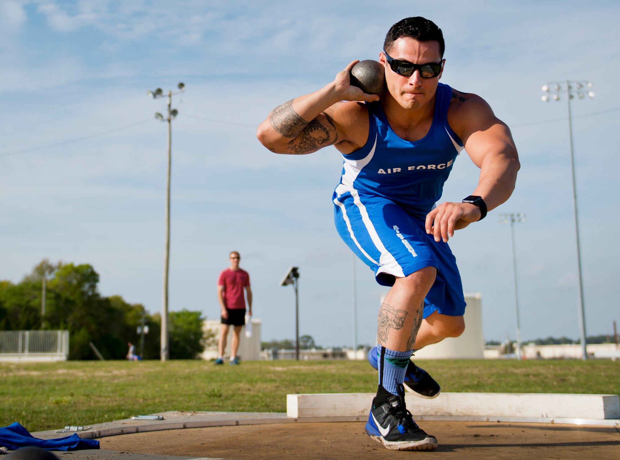 Vince Cavasos, a Warrior Care attendee, winds up for his toss during a morning track and field session at the Air Force team’s training camp at Eglin Air Force Base, Fla., April 6.  The base-hosted, week-long Warrior Games training camp is the last team practice session before the yearly competition in June.  (U.S. Air Force photo/Samuel King Jr.)