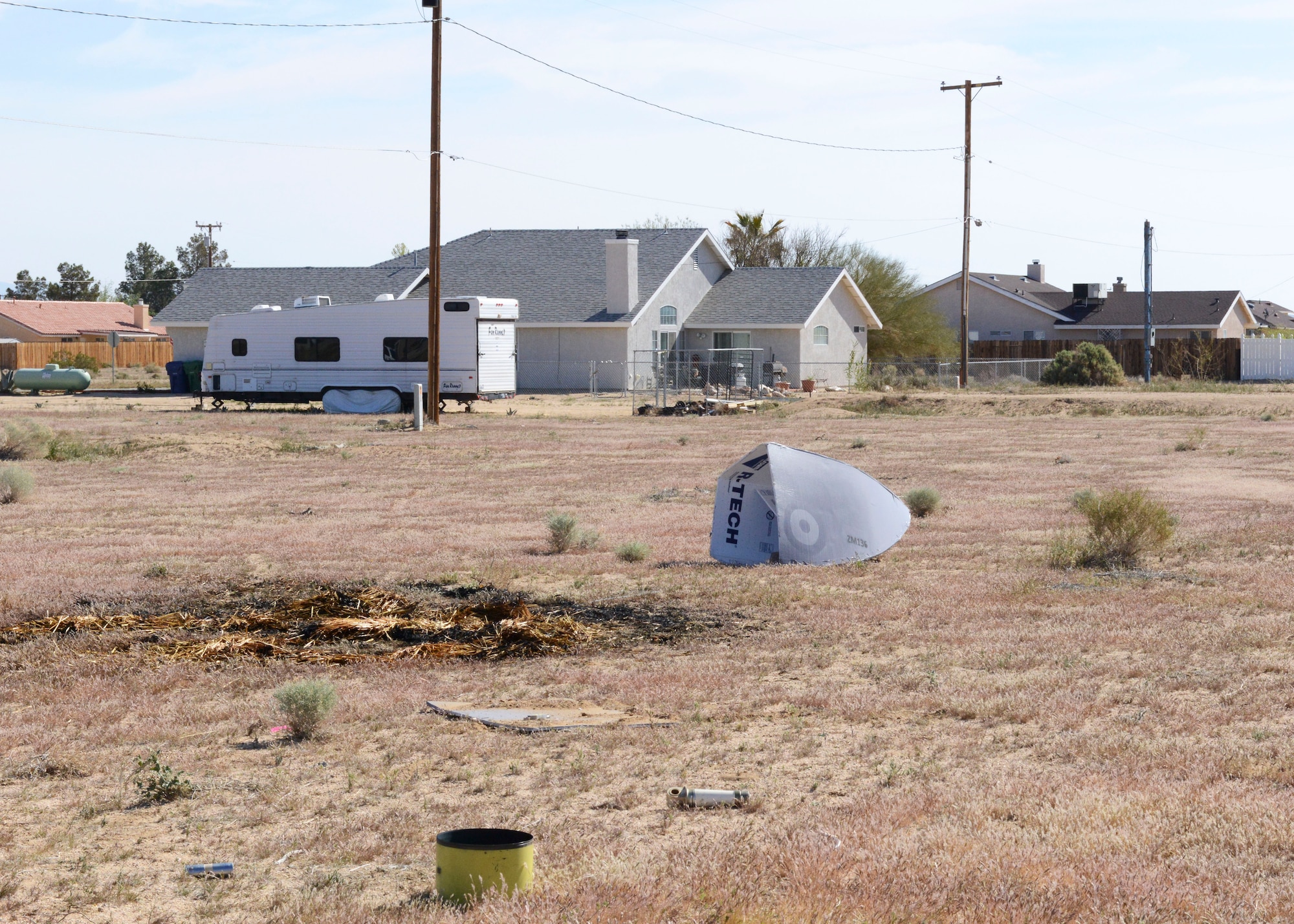 To make the exercise feel as real as possible, controlled flames were set, smoke devices were set off, and aircraft parts were strewn along the ground. (U.S. Air Force photo by Kenji Thuloweit)