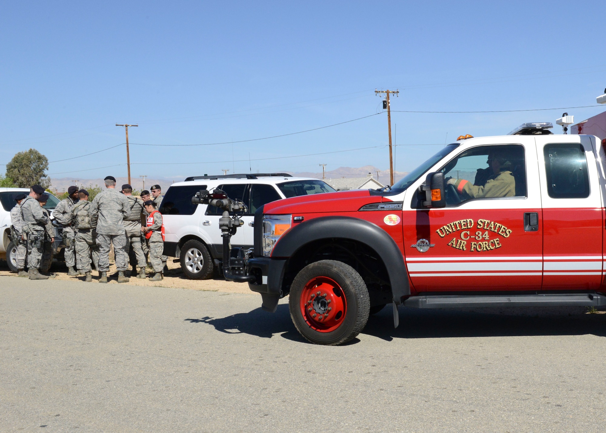 An Edwards Fire Department vehicle arrives at the scene of a simulated crash. If a crash were to occur off base, local emergency responders would be first on the scene and Edwards emergency responders would arrive to help. (U.S. Air Force photo by Kenji Thuloweit)