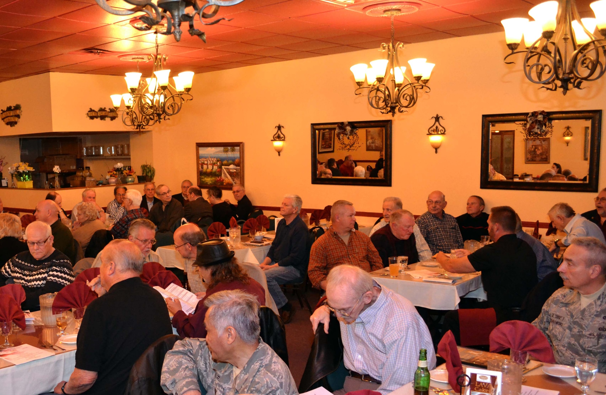 Approximately 70 former and current 111th Attack Wing members gathered to reconnect during a dinner held in their honor in Philadelphia, April 4, 2016. Commander of the 111th Attack Wing Col. Howard Eissler and Anna Richar, the Horsham AGS Airman & Family Readiness Center programs manager, addressed the crowd as keynote speakers during the event. (U.S. Air Force photo by Tech. Sgt. Andria Allmond)