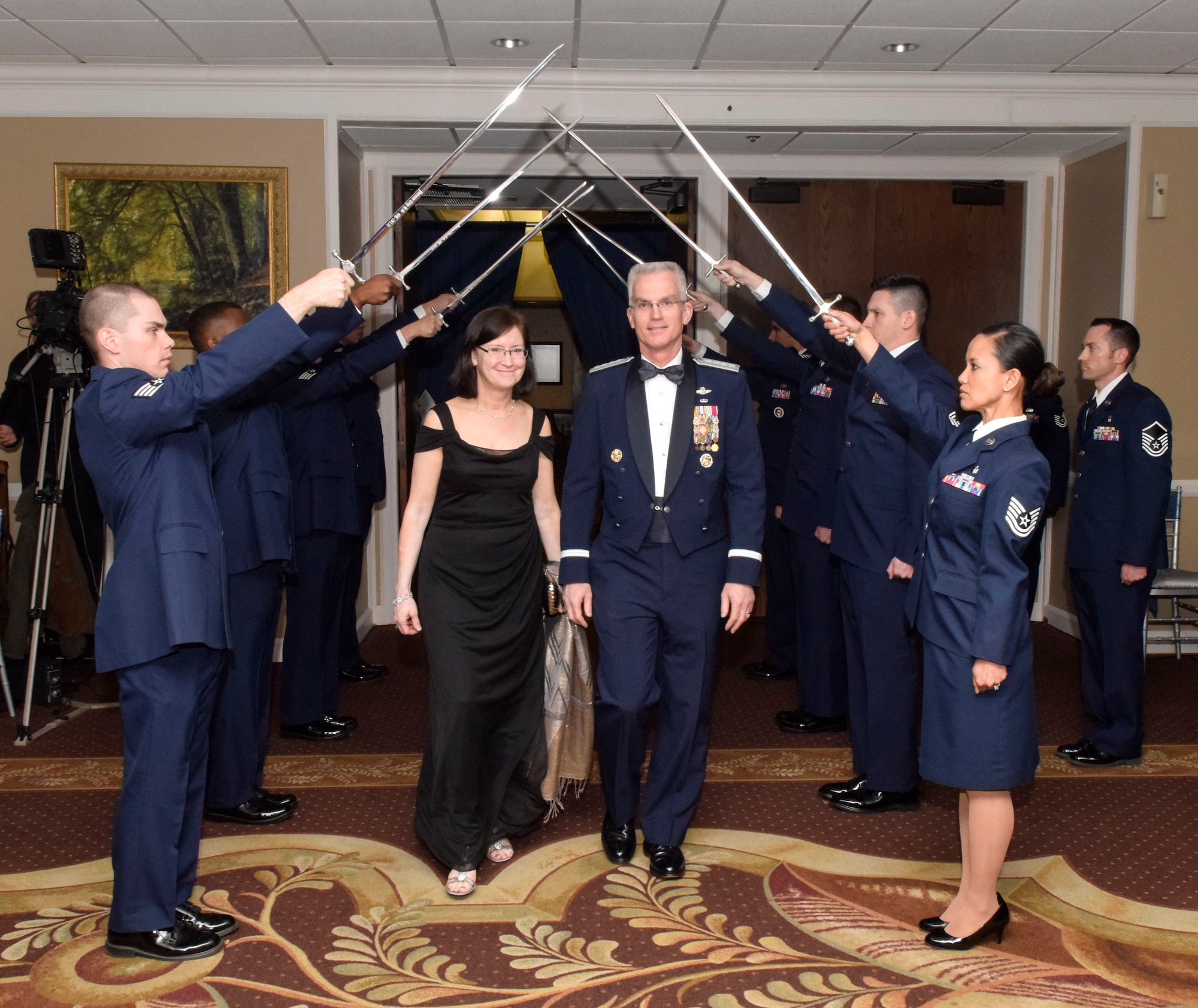Gen. Paul J. Selva, Vice Chairman of the Joint Chiefs of Staff, and his wife Ricki, walk through a ceremonial sword-arch, created by members of Team Tinker, as they enter the dining room for the Tinker Community Dining Out, April 1, 2016, Tinker Air Force Base, Okla. General Selva is the second highest ranking member of the military and toured the Air Force Sustainment Center and other units to gain a better understanding of Team Tinker’s support to the nuclear mission. (U.S. Air Force photo by Greg L. Davis)