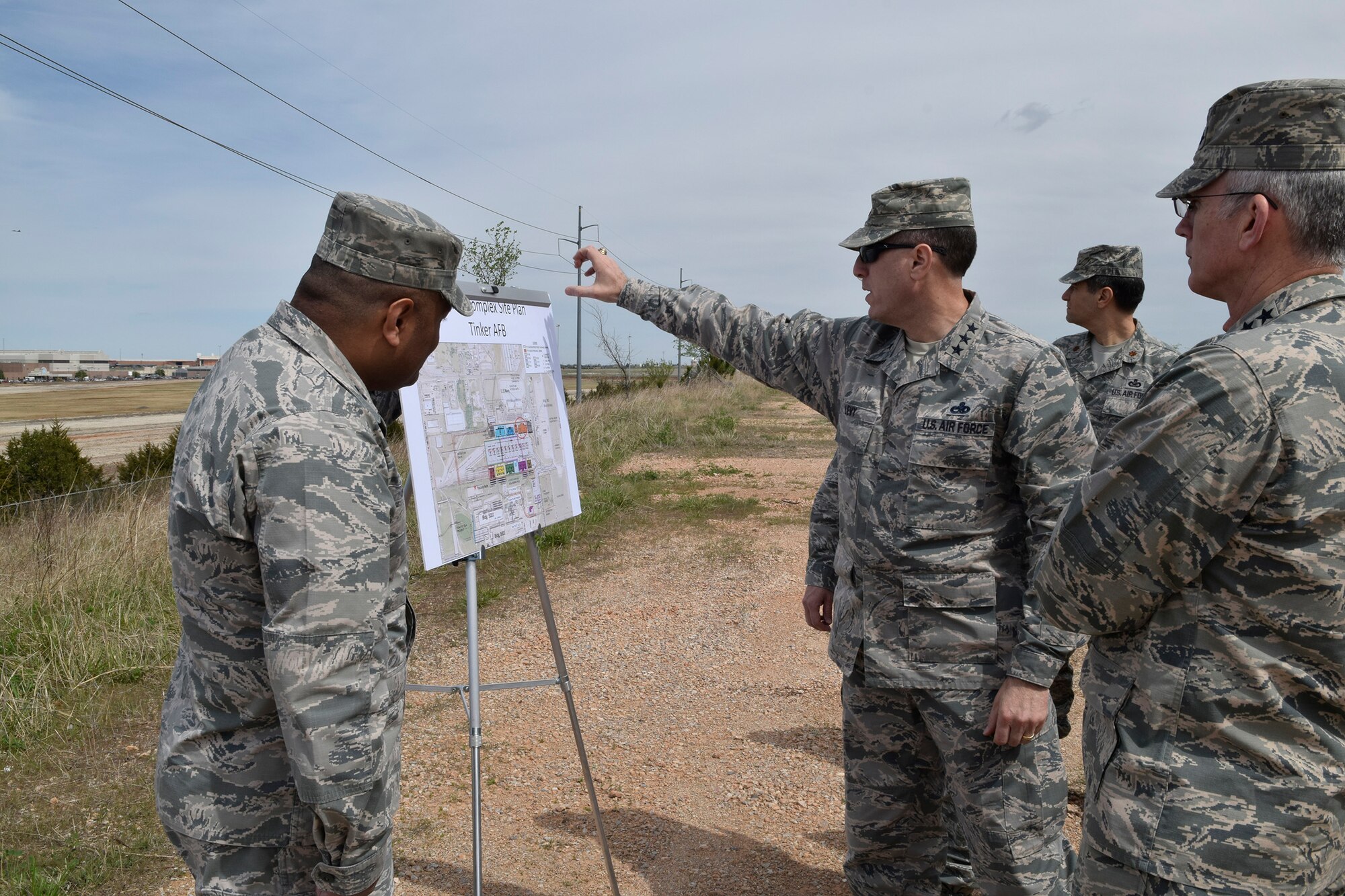 Lt. Gen. Lee K. Levy II, Air Force Sustainment Center Commander, points out key locations of the KC-46A industrial area to Gen. Paul J. Selva, Vice Chairman of the Joint Chiefs of Staff, right, after a briefing on the capacity and capability of Bldg. 9001 and the military construction plan for the new KC-46A industrial area. The briefing, conducted April 1 at the KC-46A industrial area overlook site north of Bldg. 9001, also highlighted how close community relations resulted in the Air Force being able to acquire the area.  (U.S. Air Force photo by Greg L. Davis)