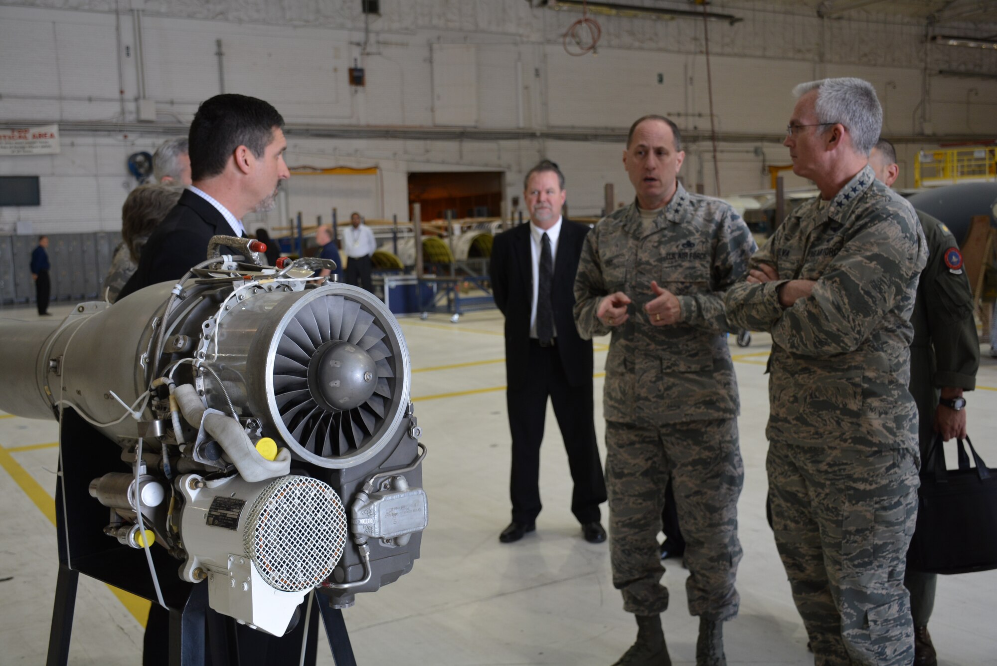 Lt. Gen. Lee K. Levy II, Air Force Sustainment Center Commander, comments during a briefing to Gen. Paul J. Selva, Vice Chairman of the Joint Chiefs of Staff, right, April 1, by Mr. John R. Sneden, Air Force Life Cycle Management Center Propulsion Sustainment Division Chief, left, on F107 engine challenges.  The F107 engine is used to power cruise missiles, the F-22 vapor cycle system and the ethyl glycol and water pumps for the B-2 bomber. Also in the photo is Mr. Charles Alley, 565th Aircraft Maintenance Squadron director.  (U.S. Air Force photo by Darren Heusel)