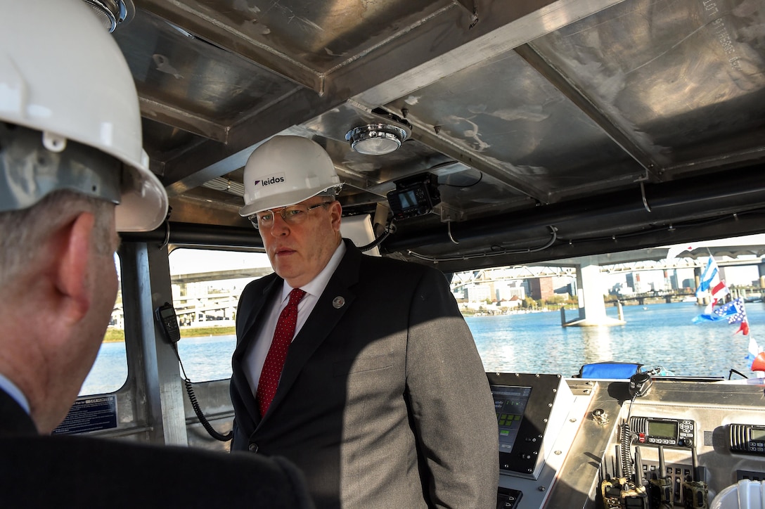 Deputy Defense Secretary Bob Work tours the wheelhouse before a Defense Advanced Research Projects Agency christening ceremony for a technology demonstration vessel designed, developed and built through DARPA’s anti-submarine warfare continuous trail unmanned vessel program in Portland, Ore., April 7, 2016. DoD photo by Army Sgt. 1st Class Clydell Kinchen