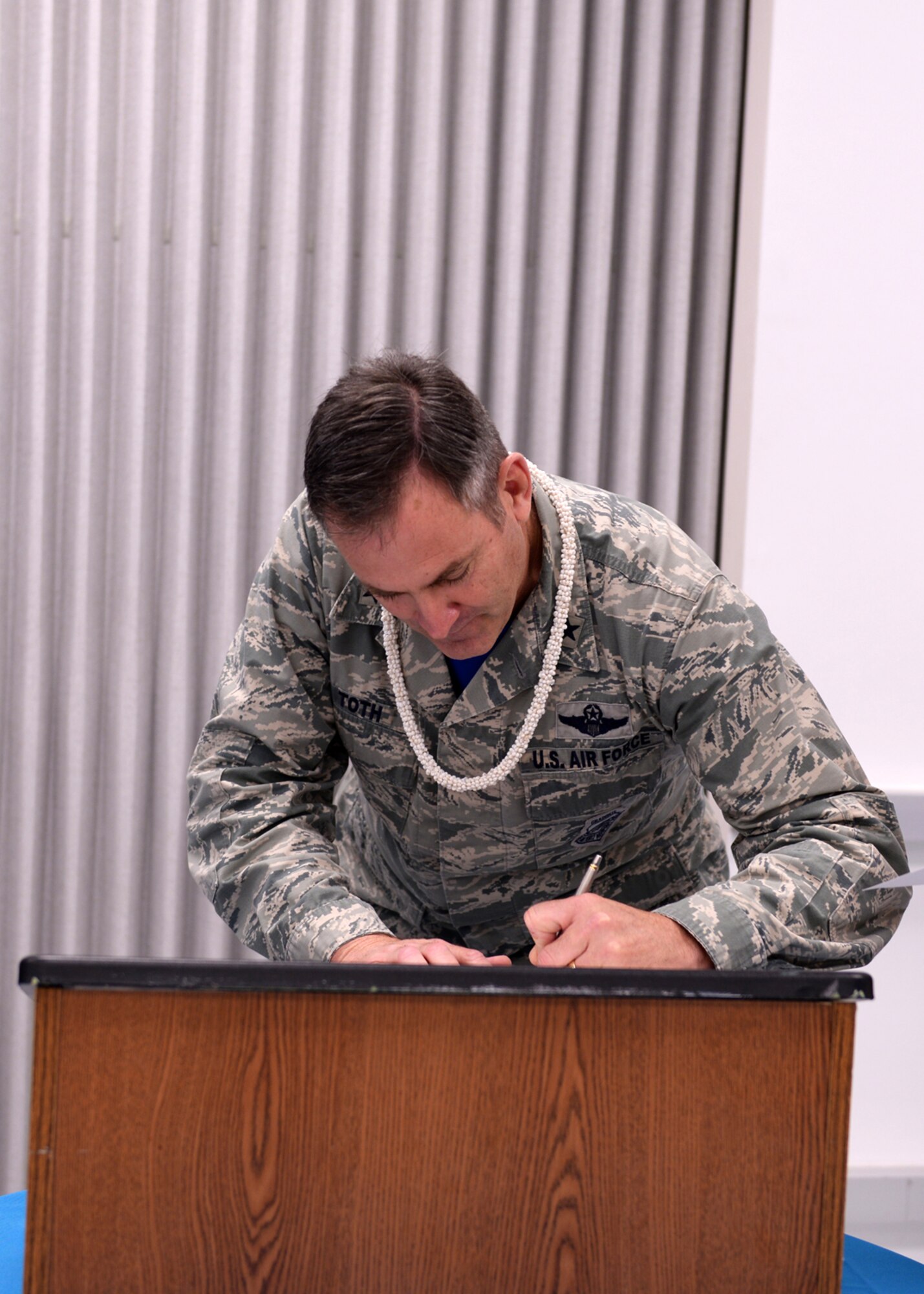 Brig. Gen. Andrew Toth, 36th Wing commander, signs a proclamation for sexual assault and awareness prevention month with other Joint Region Marianas senior leaders April 1, 2016, at Guam Community College, Mangilao, Guam. The proclamation signing kicked off the SAAPM for JRM, which solidifies the Air Force’s zero tolerance policy on sexual assault, outlining how Airmen will be there for their wingmen in times of crises and to speak up when they see something. (U.S. Air Force photo by Senior Airman Cierra Presentado/Released)