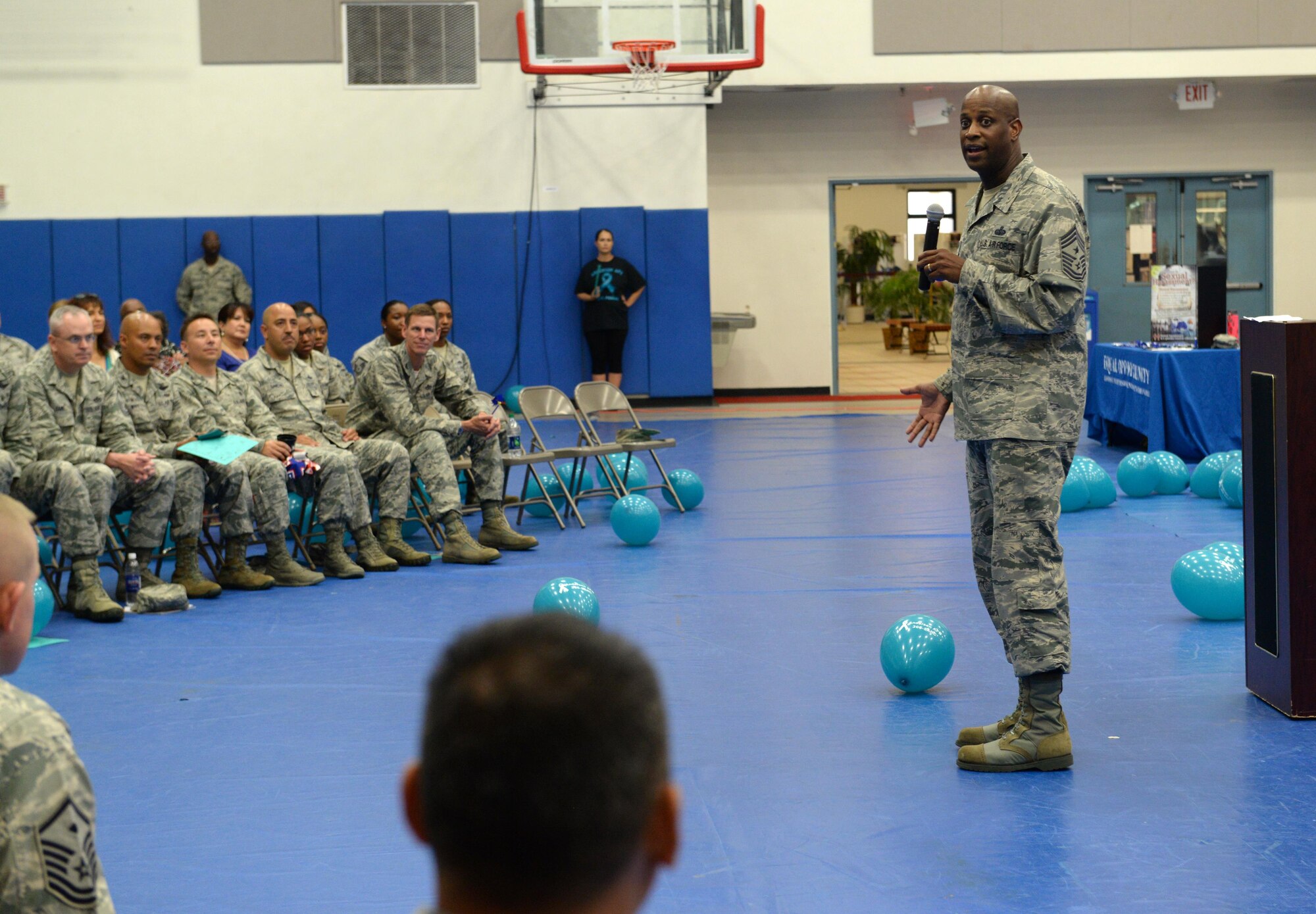Chief Master Sgt. Michael McMillan, 36th Wing command chief, speaks about sexual assault prevention and response during an awareness rally April 1, 2015, at Andersen Air Force Base, Guam. April is recognized as Sexual Assault and Awareness Prevention month, which is dedicated to raising awareness and educating Airmen and their families about prevention methods. (U.S. Air Force photo/Airman 1st Class Alexa Ann Henderson/Released)