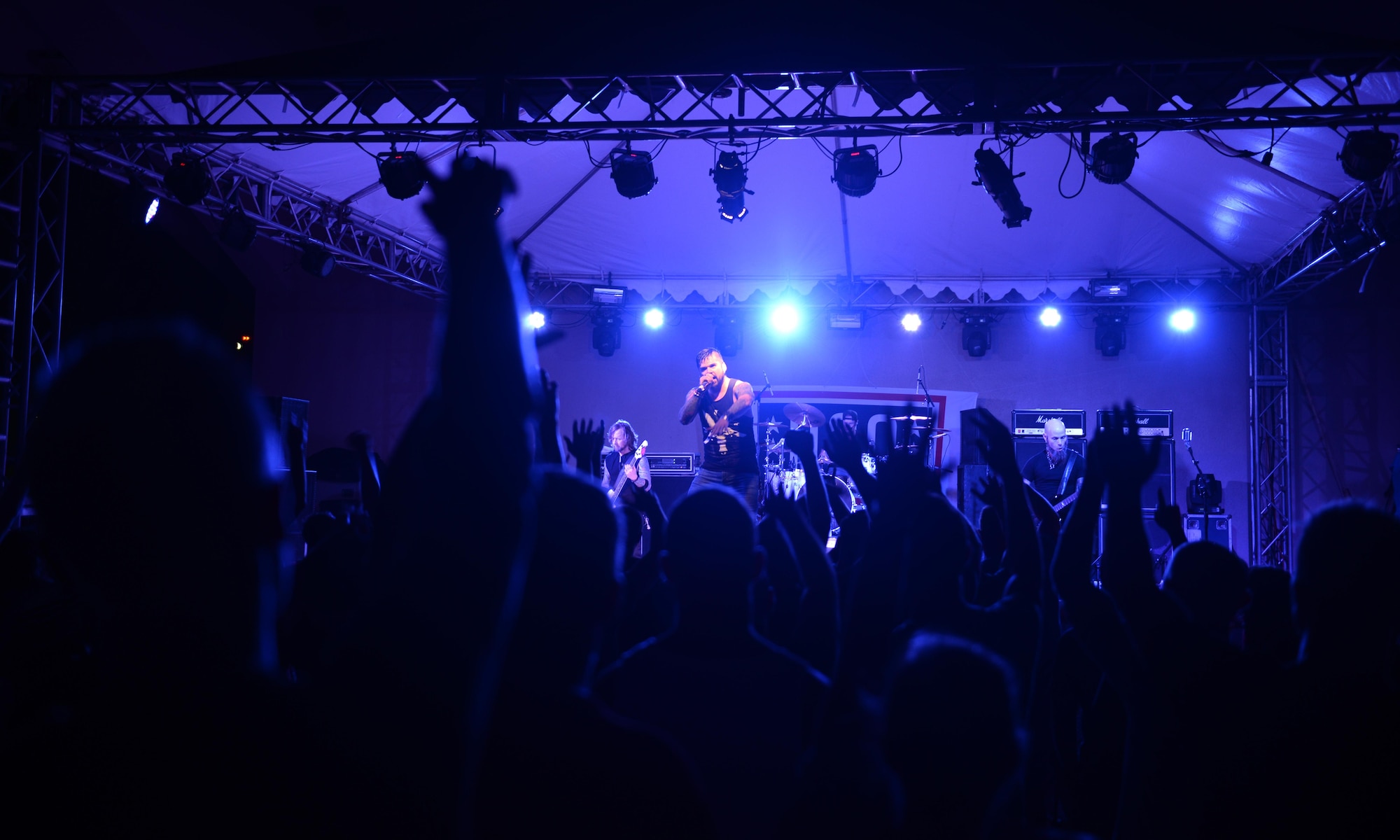 Fans cheer during the Drowning Pool concert April 6, 2016, at Andersen Air Force Base, Guam. Along with the United Service Organizations, USO, the 36th Force Support Squadron holds free concerts throughout the year for Team Andersen. (U.S. Air Force photo by Airman 1st Class  Jacob Skovo)