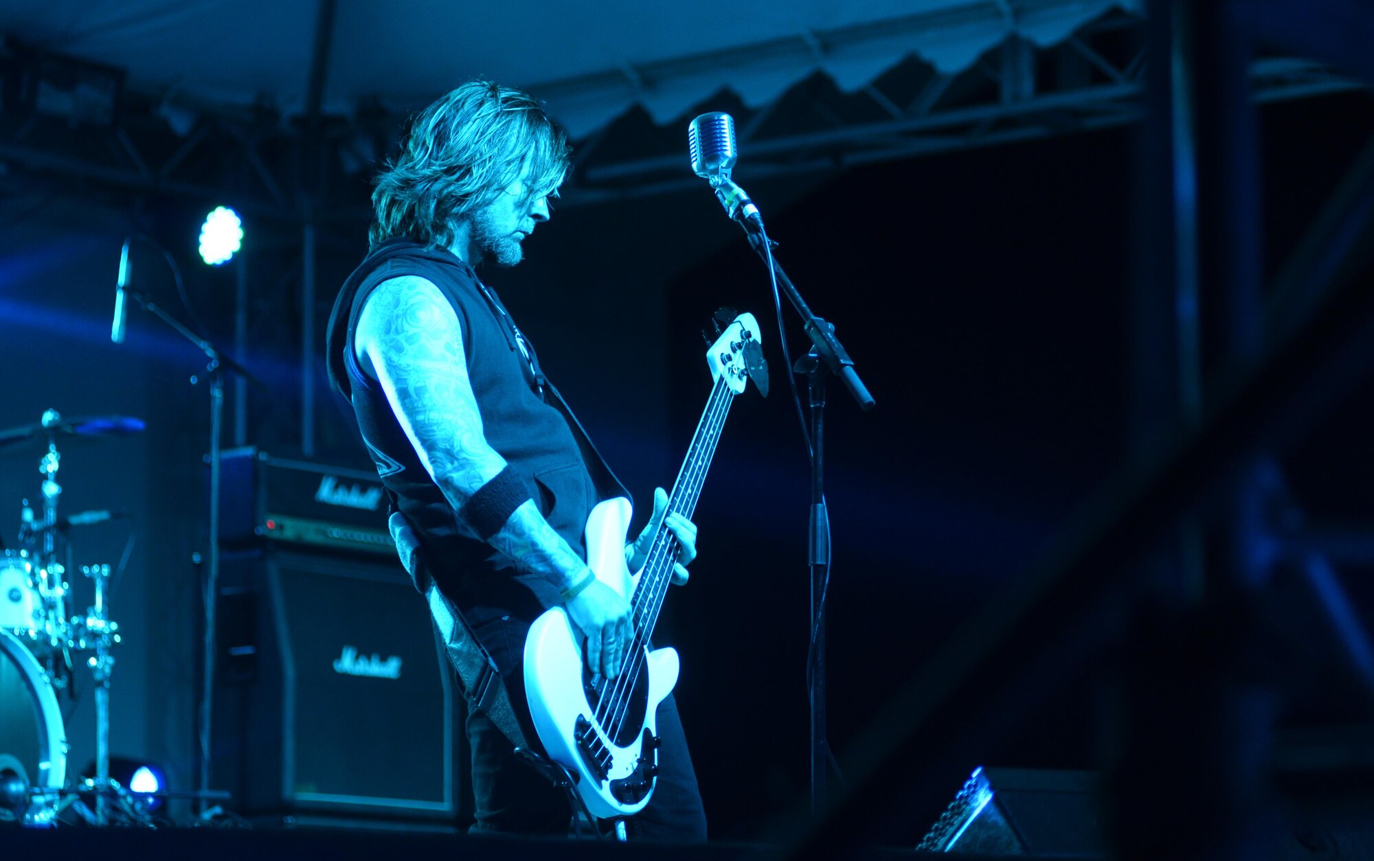 Stevie Benton, bassist for Drowning Pool, plays a guitar solo April 6, 2016, at Andersen Air Force Base, Guam. Benton has been performing with the band since its formation in 1996. (U.S. Air Force photo by Airman 1st Class  Jacob Skovo)